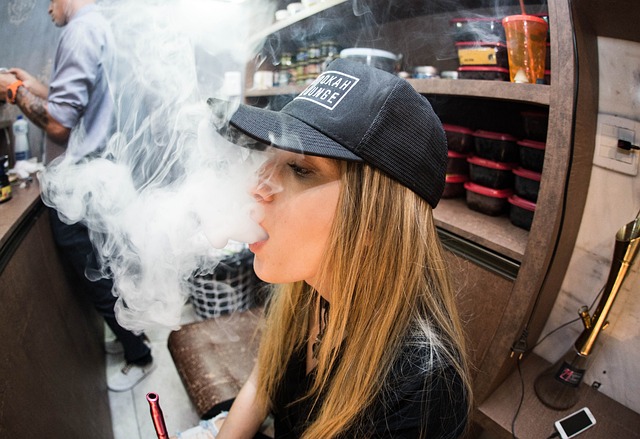 An image of a woman vaping.