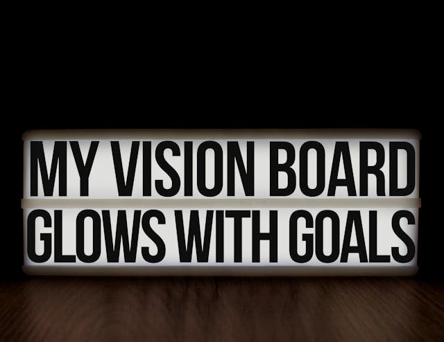 An image of a sign that says my visio board glows with goals.