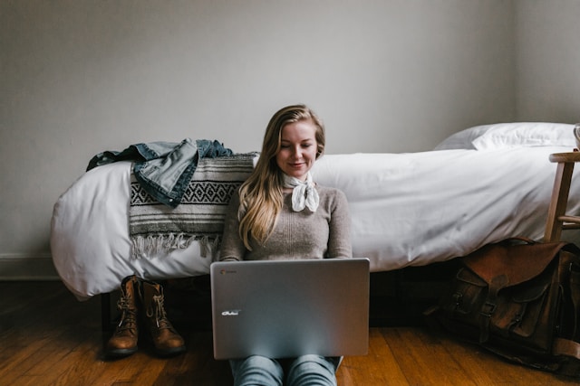 Content optimization is one of the best work from home jobs out there. An image of a woman editing from her laptop.