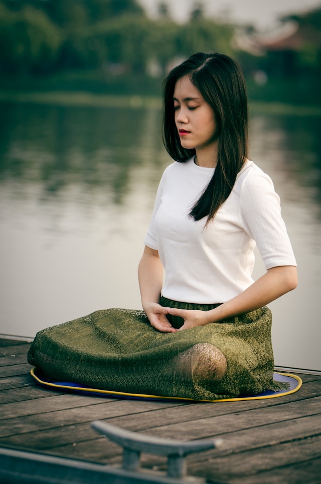 An image of a woman meditating.