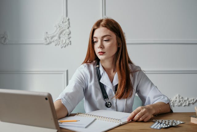 An image of a woman working from home.