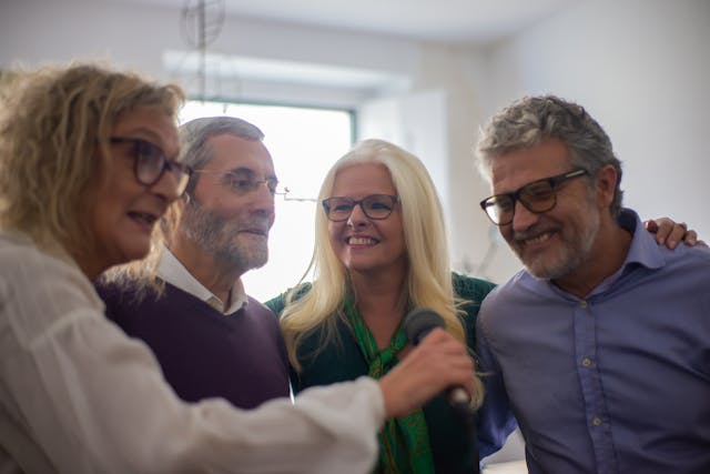 An image of a family doing karaoke.