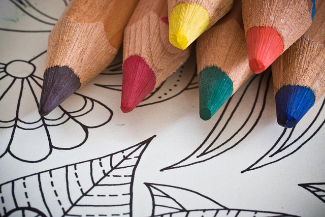 An image of a coloring book page and colored pencils for a Happy Valentine's Day 2025 gift idea.