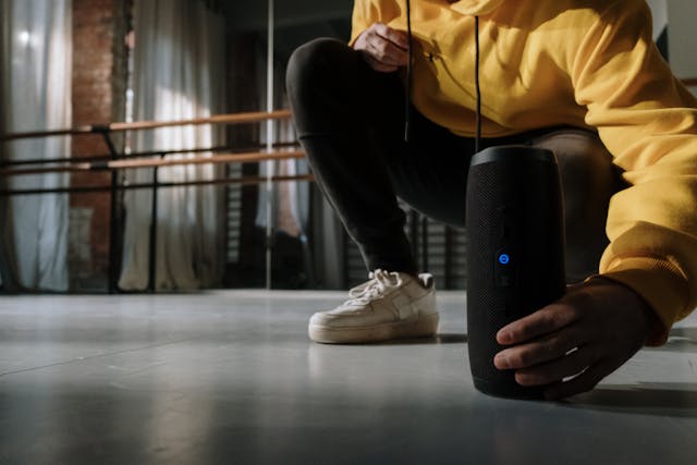 An image of someone using a portable bluetooth speaker for a Happy Valentine's Day 2025 gift idea.