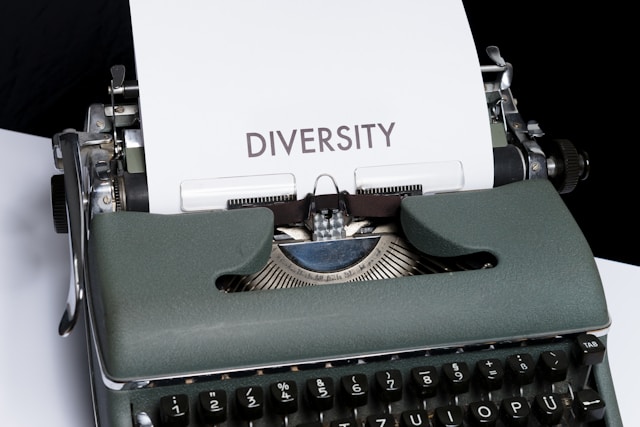 An image of a typewriter with a piece of paper that says 'diversity.'