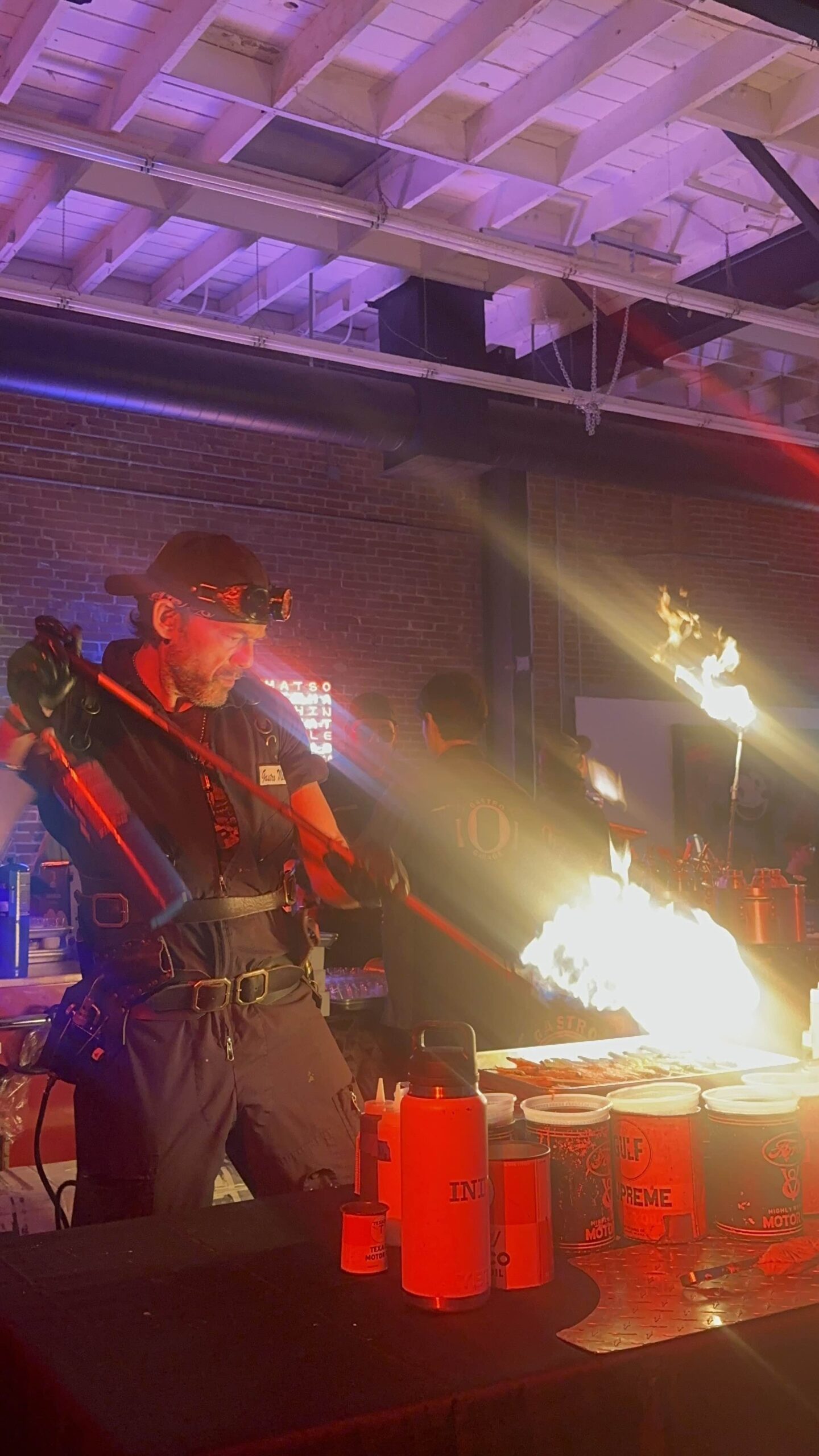 An image of one of the gastro mechanics torching a platter of food.