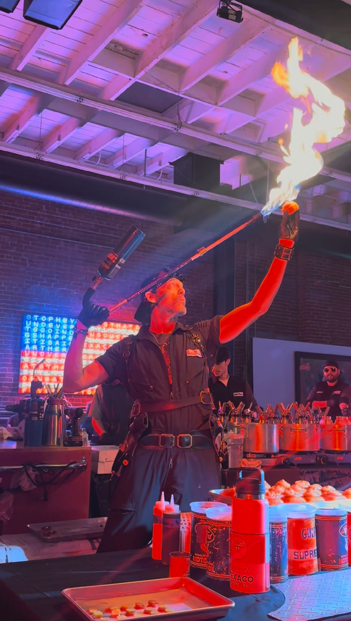 An image of one of the Gastro Mechanics torching a donut.