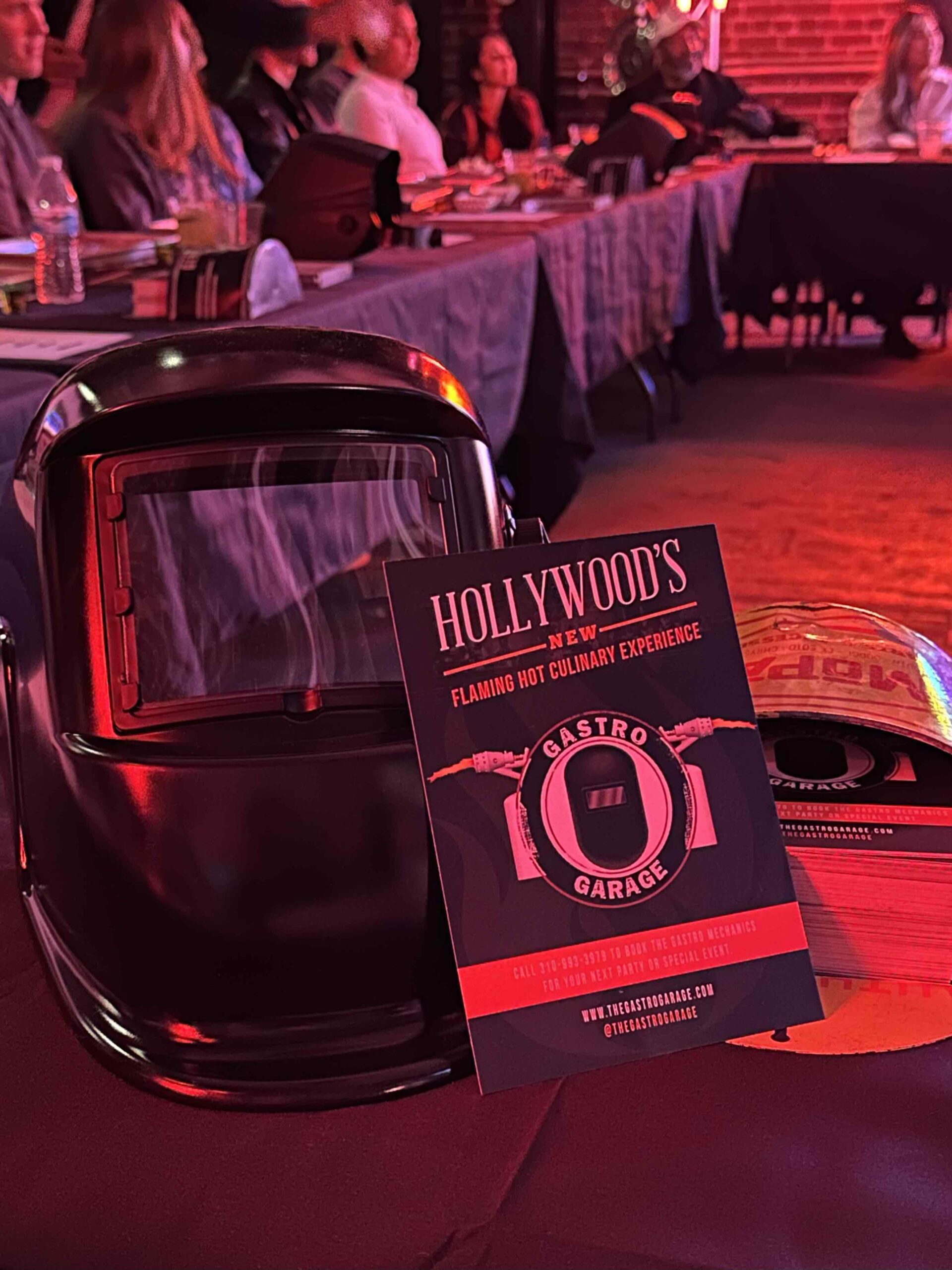 An image of a blowtorch mask and flyer for the Gastro Garage.