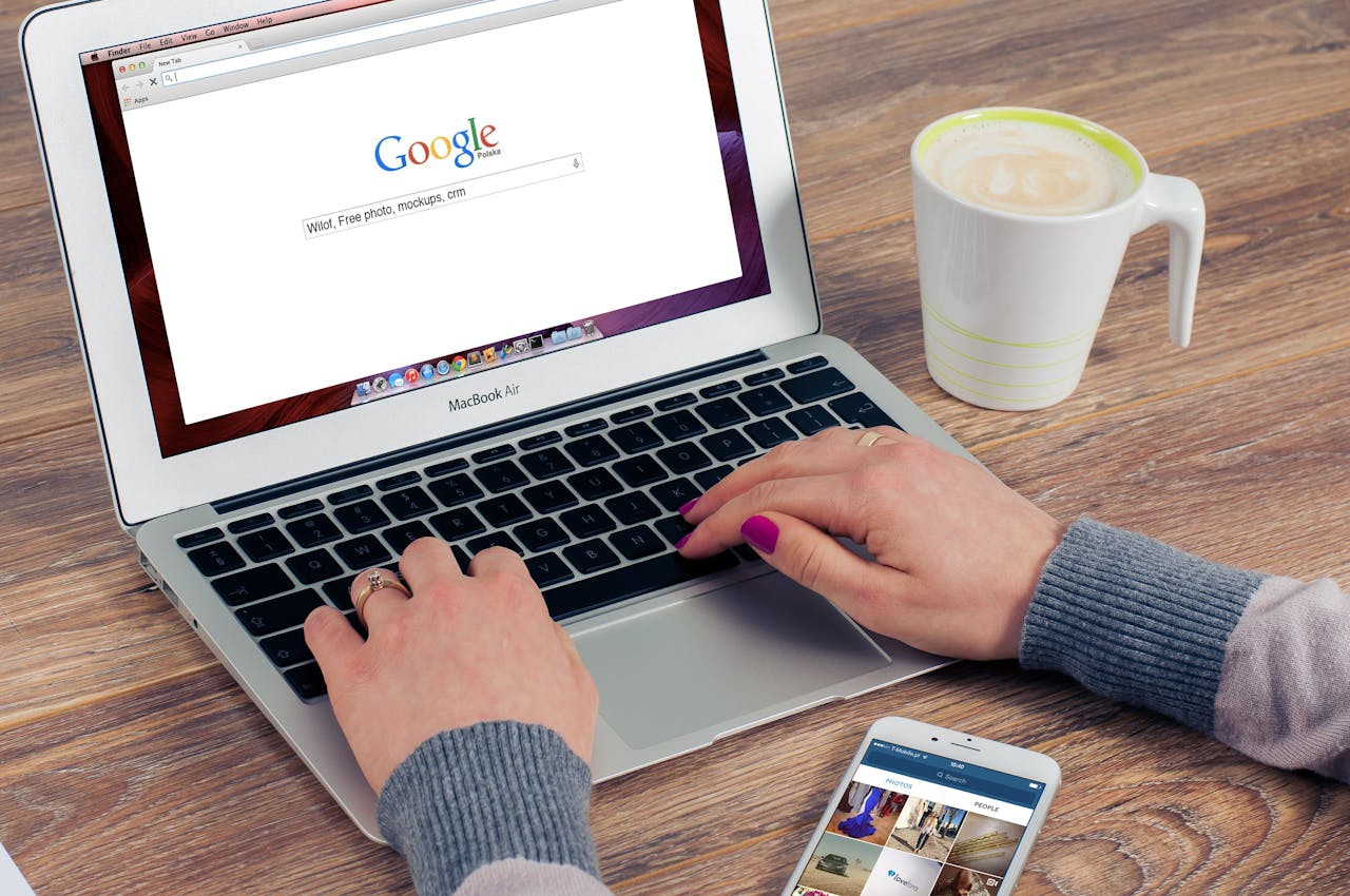An image of someone using a laptop and on the Google search engine.