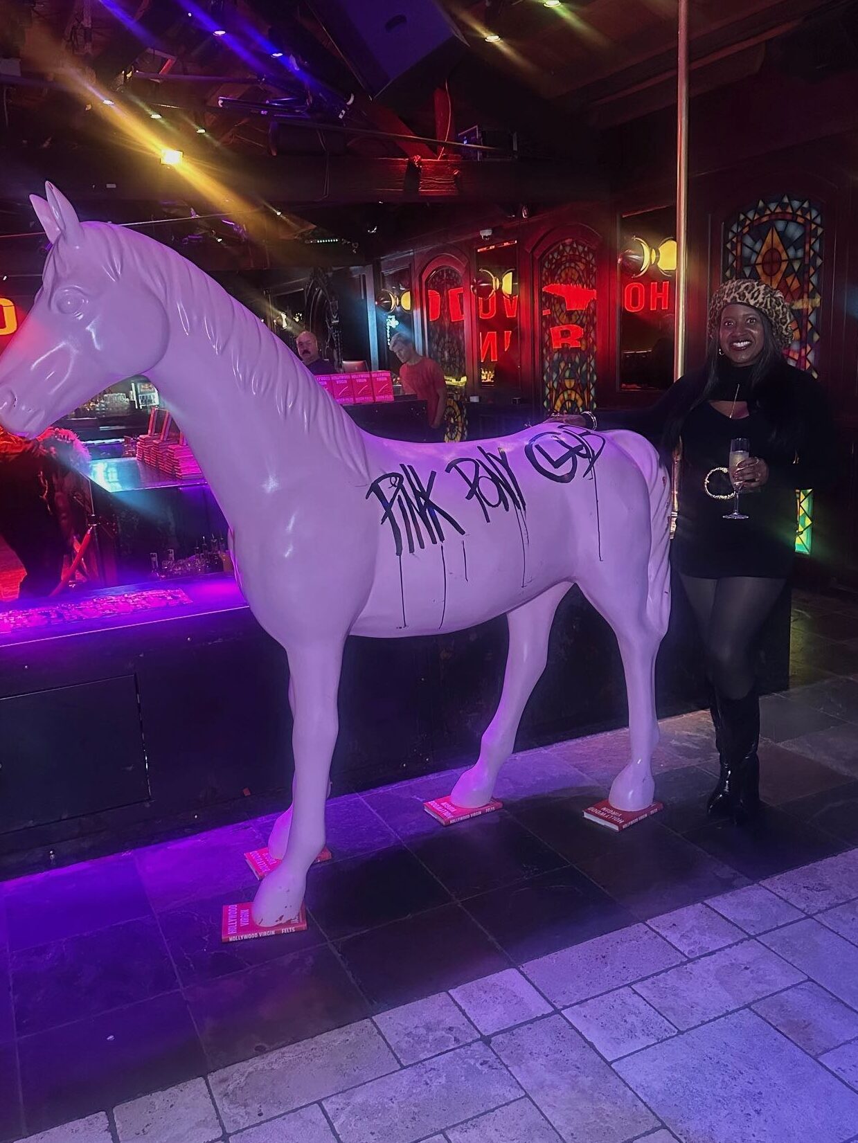 An image of lifestyle blogger Ariel Johns with a fake pink pony at the Abbey - the real Pink Pony Club.