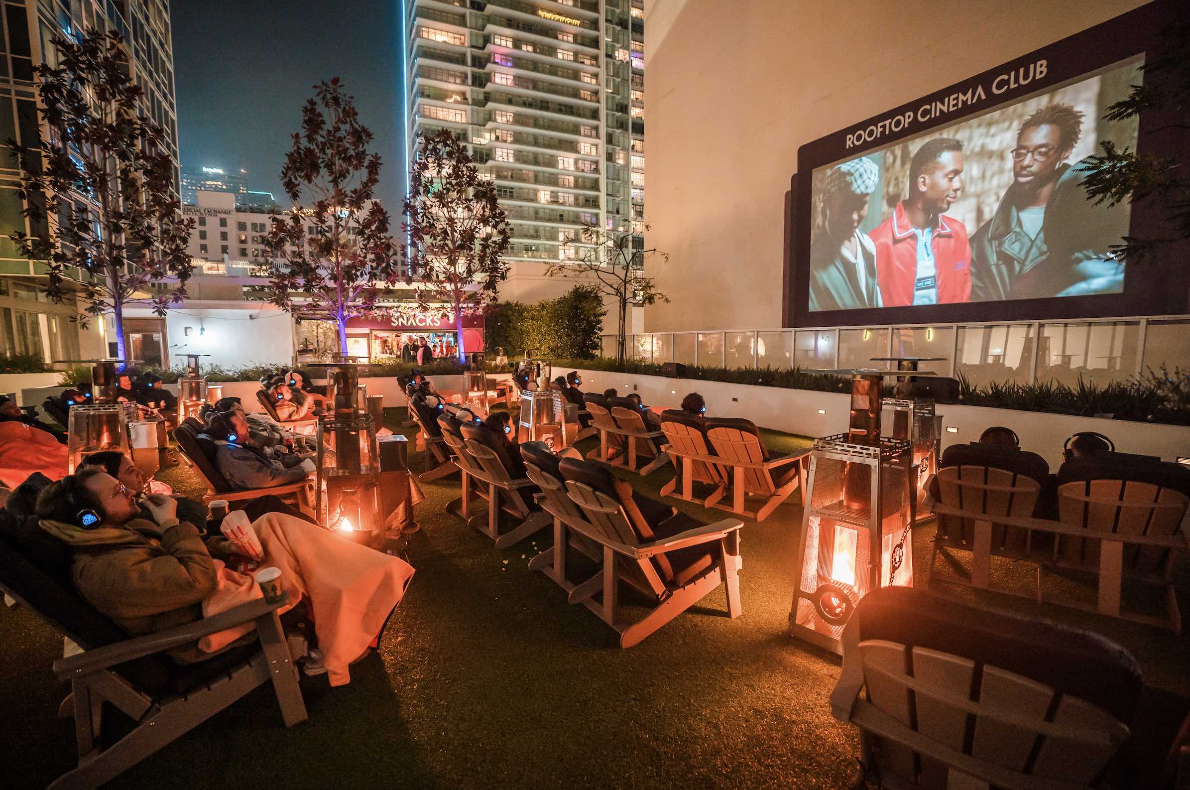 An image of a fireside films screening of a movie at Rooftop Cinema Club.