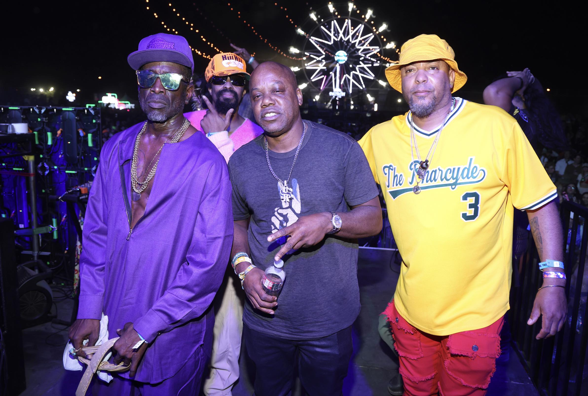 An image of Hip-hop legends The Pharcyde and Too $hort (middle) pose for a photo opp at Neon Carnival.