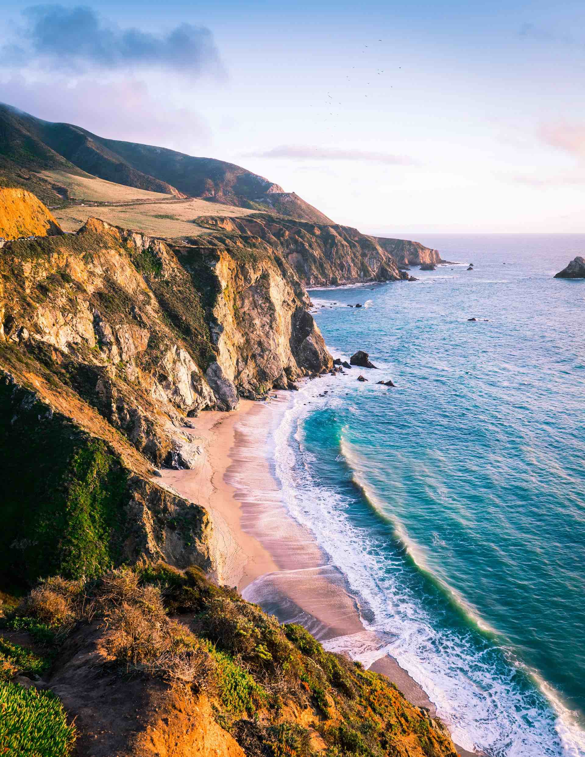 An image of the ocean and cliffs of Big Sur.