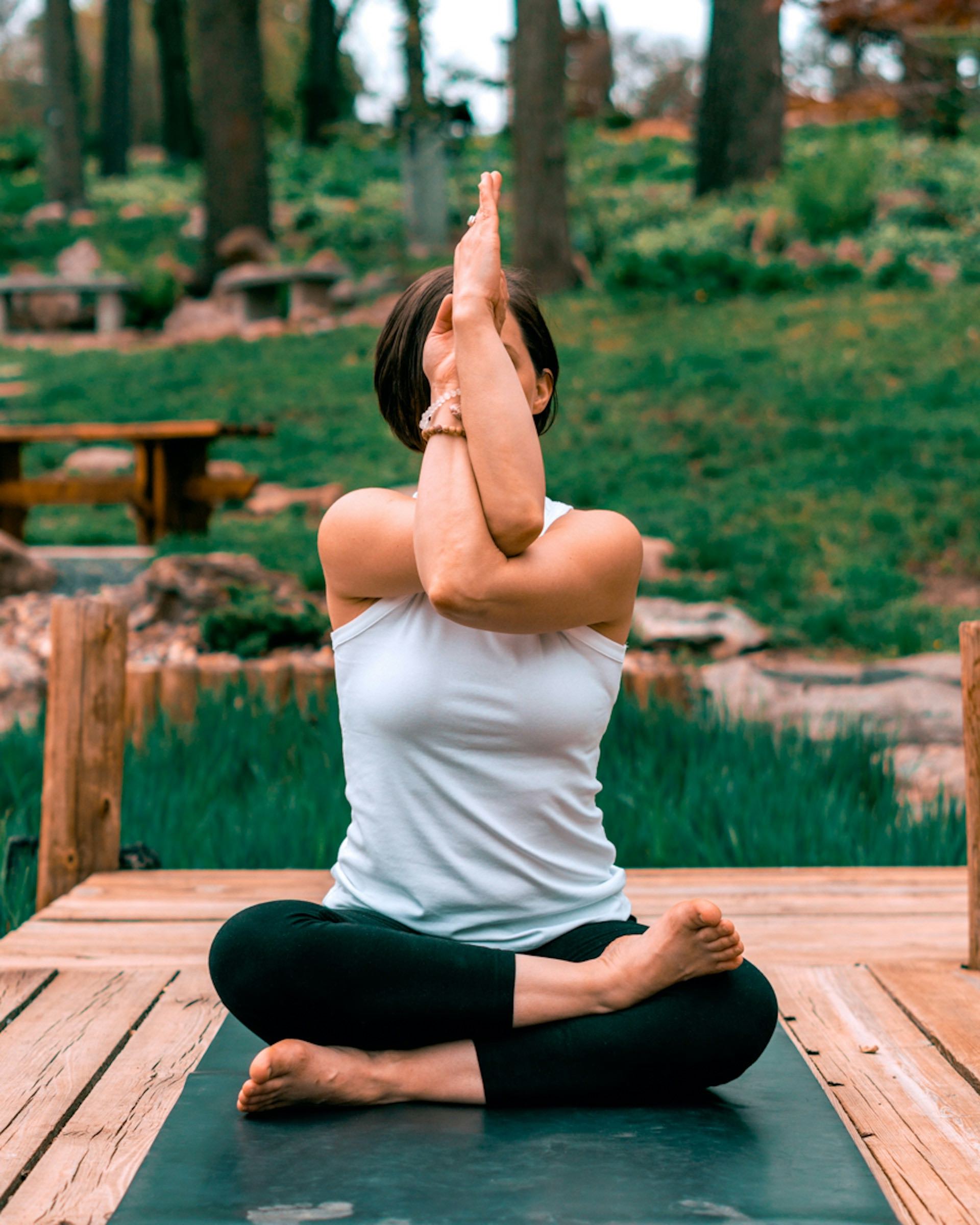 An image of a woman doing yoga outside.