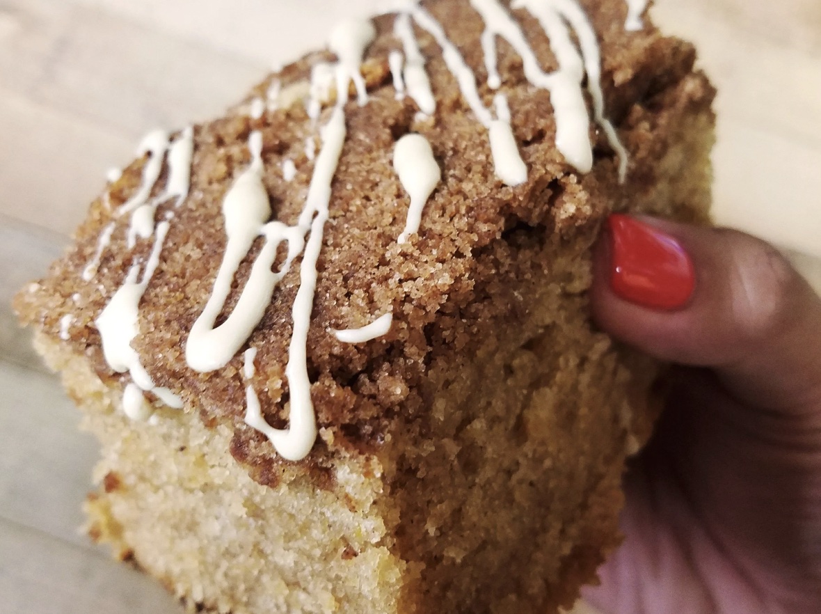 An image of someone holding a coffee cake from Crème Caramel LA.