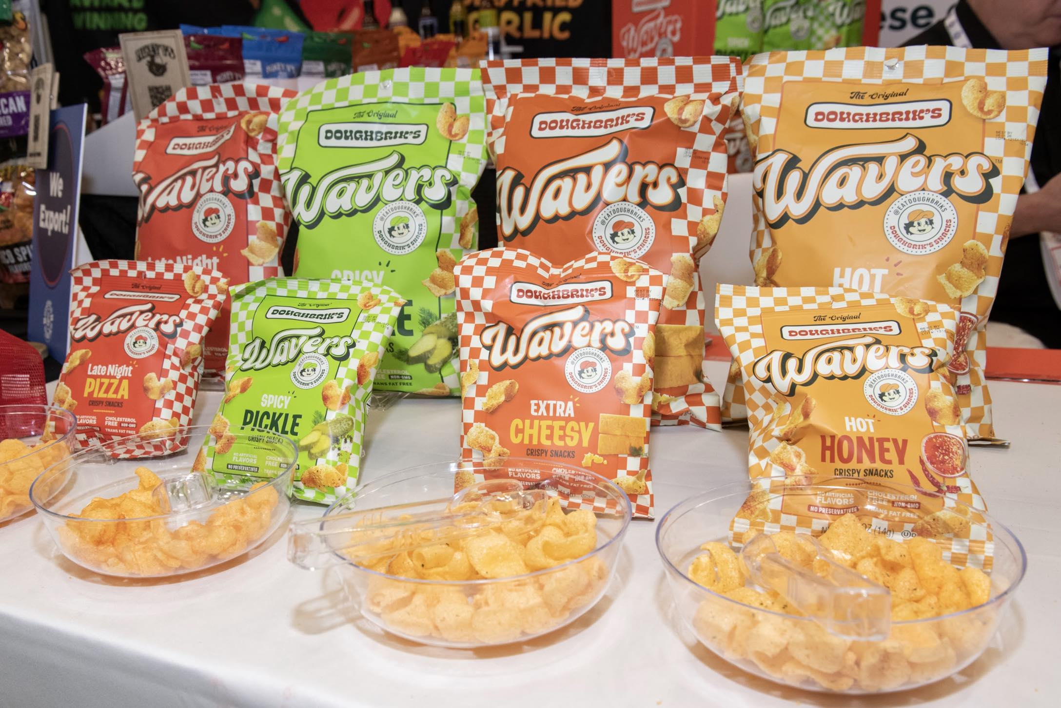 An image of the four flavors in the Wavers by The Original DOUGHBRIK’S Snacks collection – Late Night Pizza, Spicy Pickle, Extra Cheesy, and Hot Honey