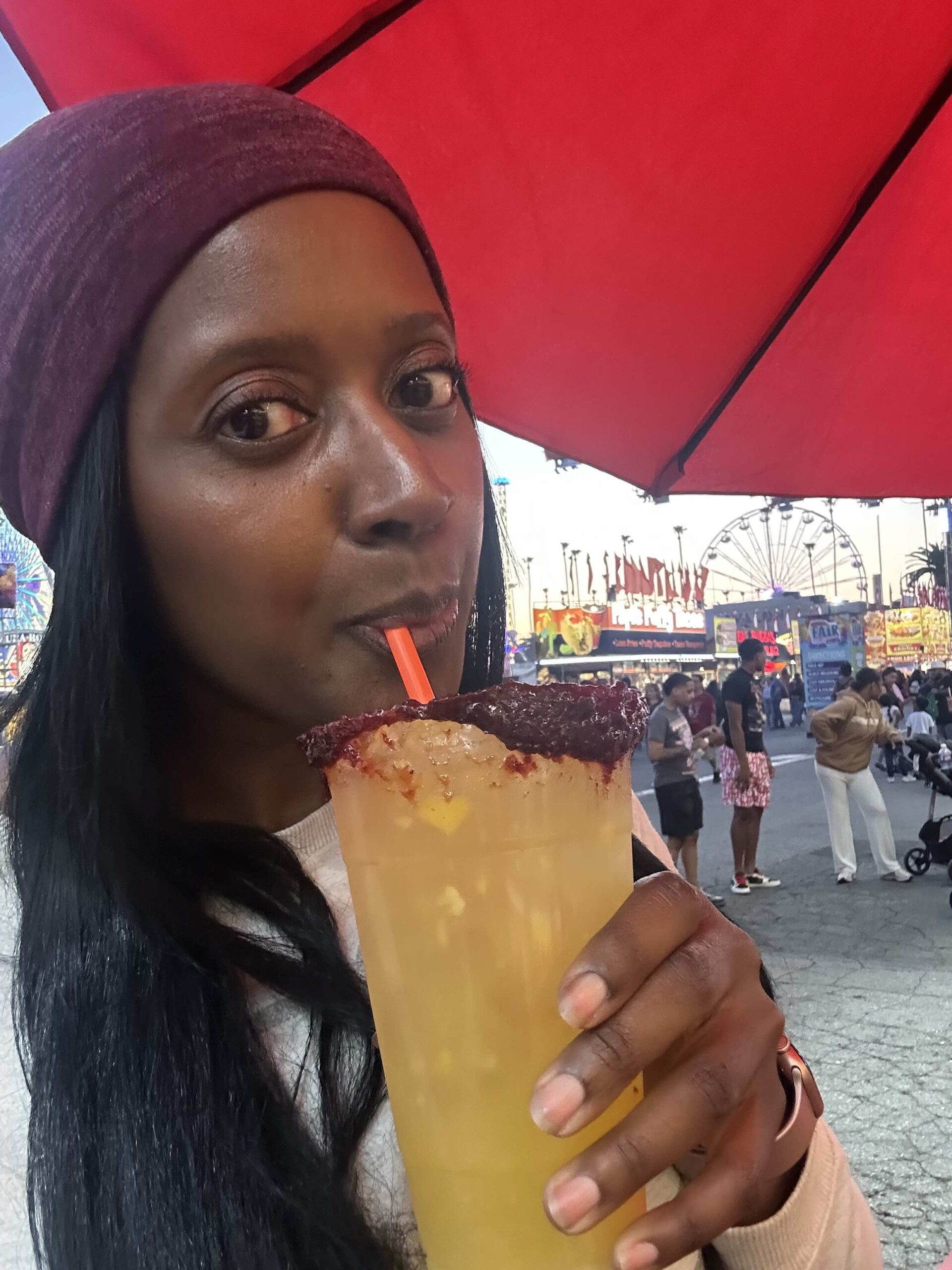 An image of lifestyle blogger Ariel drinking a Mango Agua Fresca.