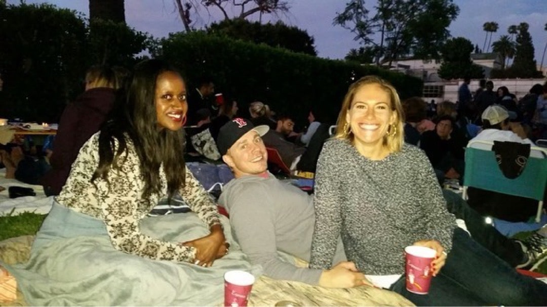 An image of lifestyle blogger Ariel Johns and friends at an outdoor screening at Hollywood Forever Cemetery.