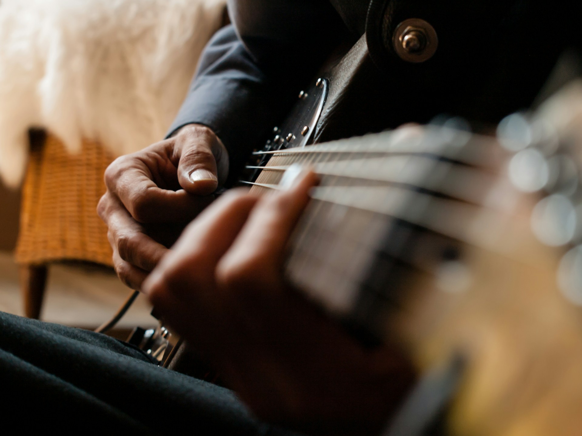 An image of someone playing the Blues on a guitar.