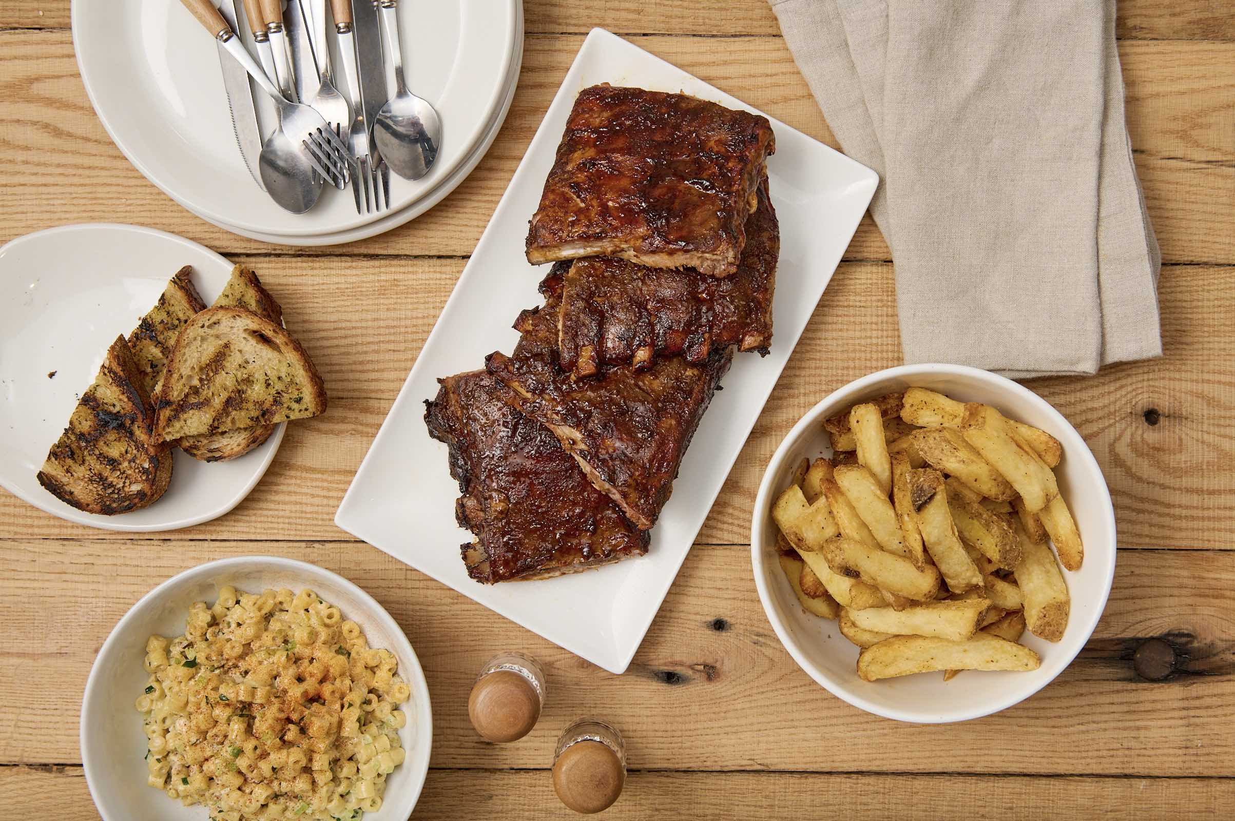 An image of the St. Louis style ribs Family Meal Deal at Tender Greens.