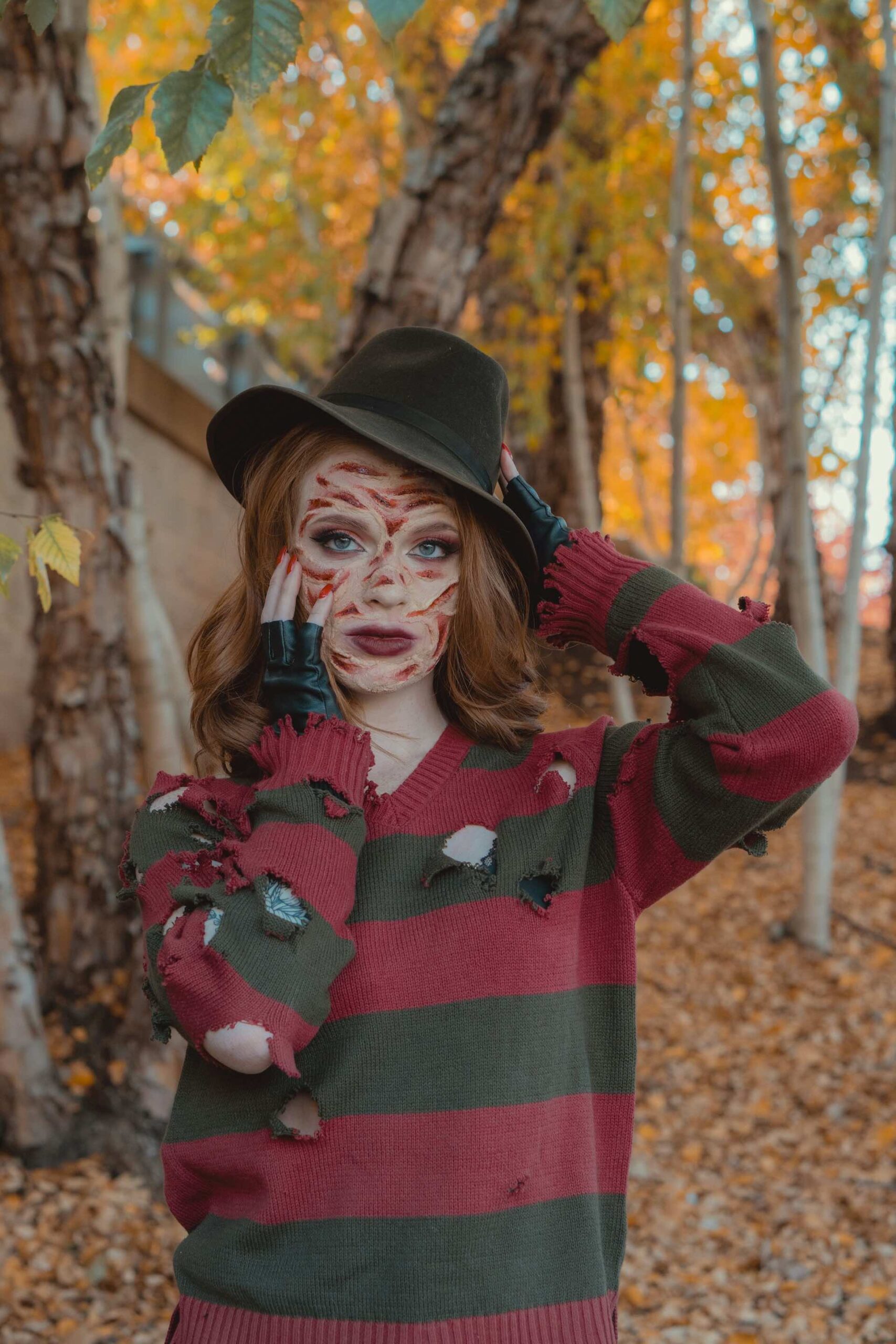 An image of a woman dressed up in a Freddy Krueger costume. 