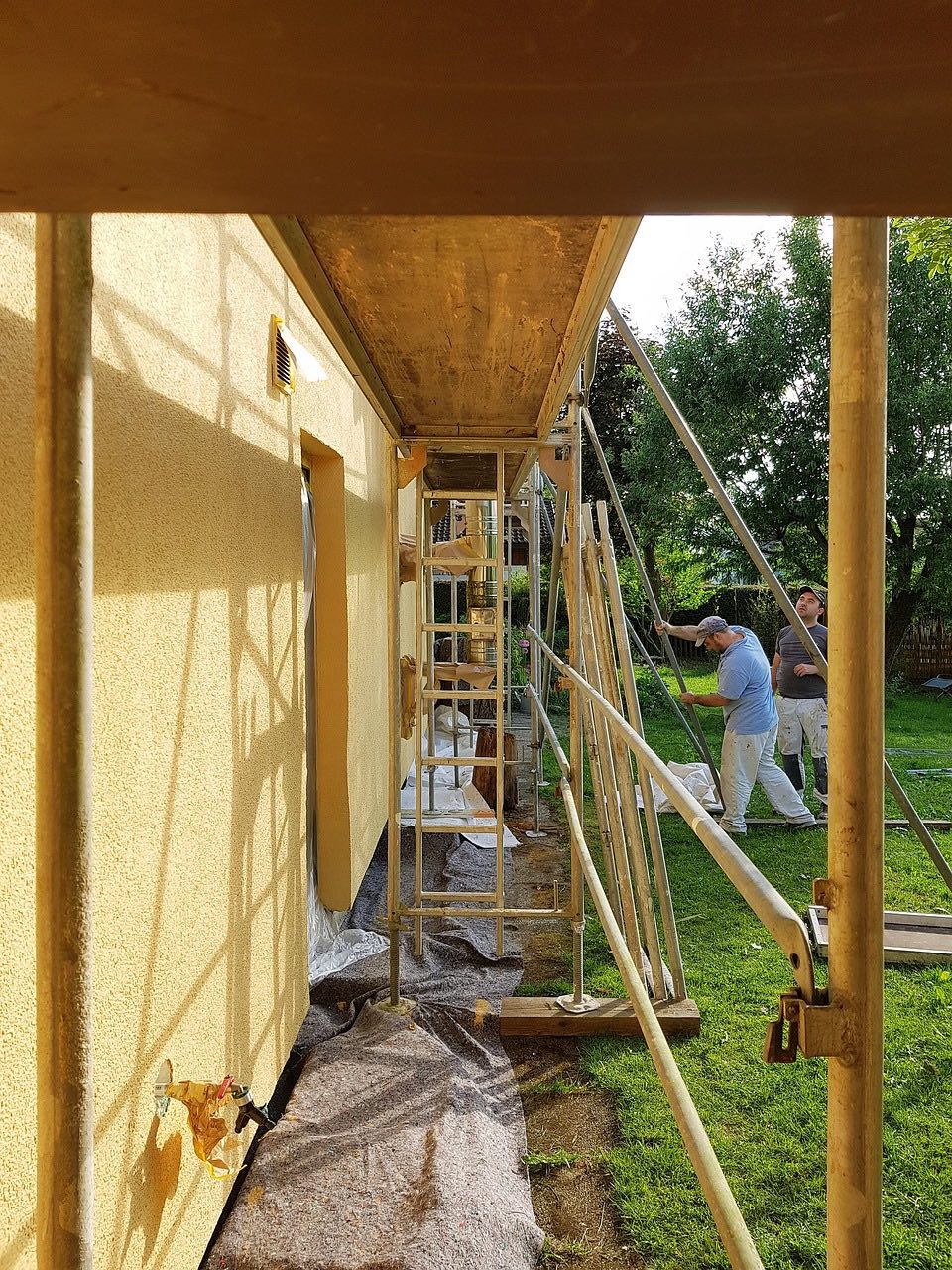 An image of people building a house.