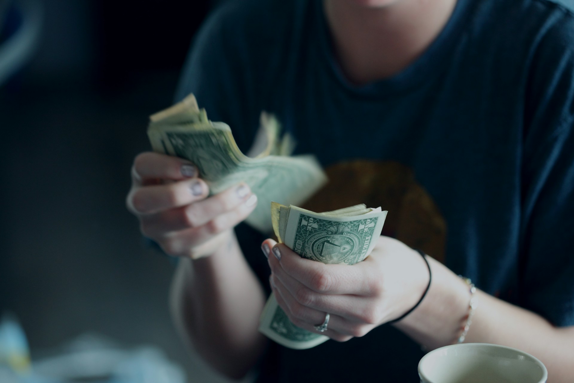 An image of someone counting money.