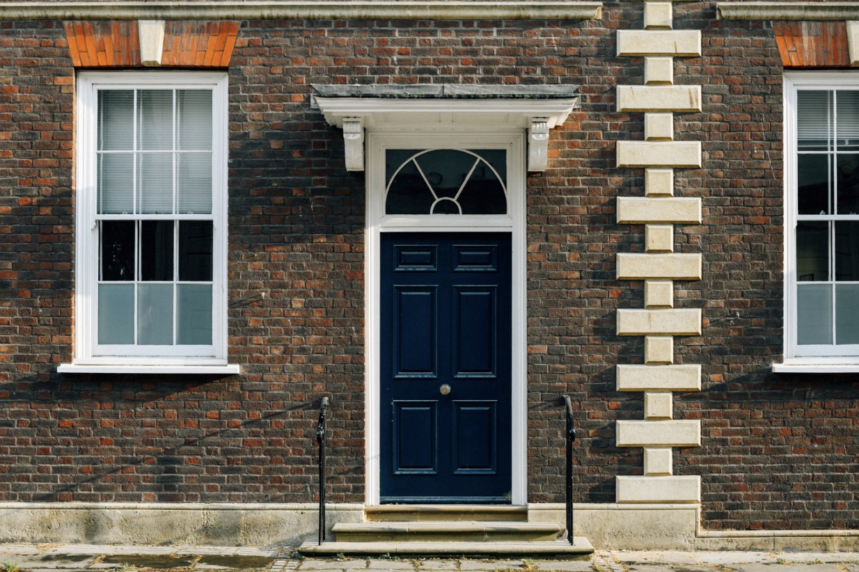 An image of the exterior of a brick home.