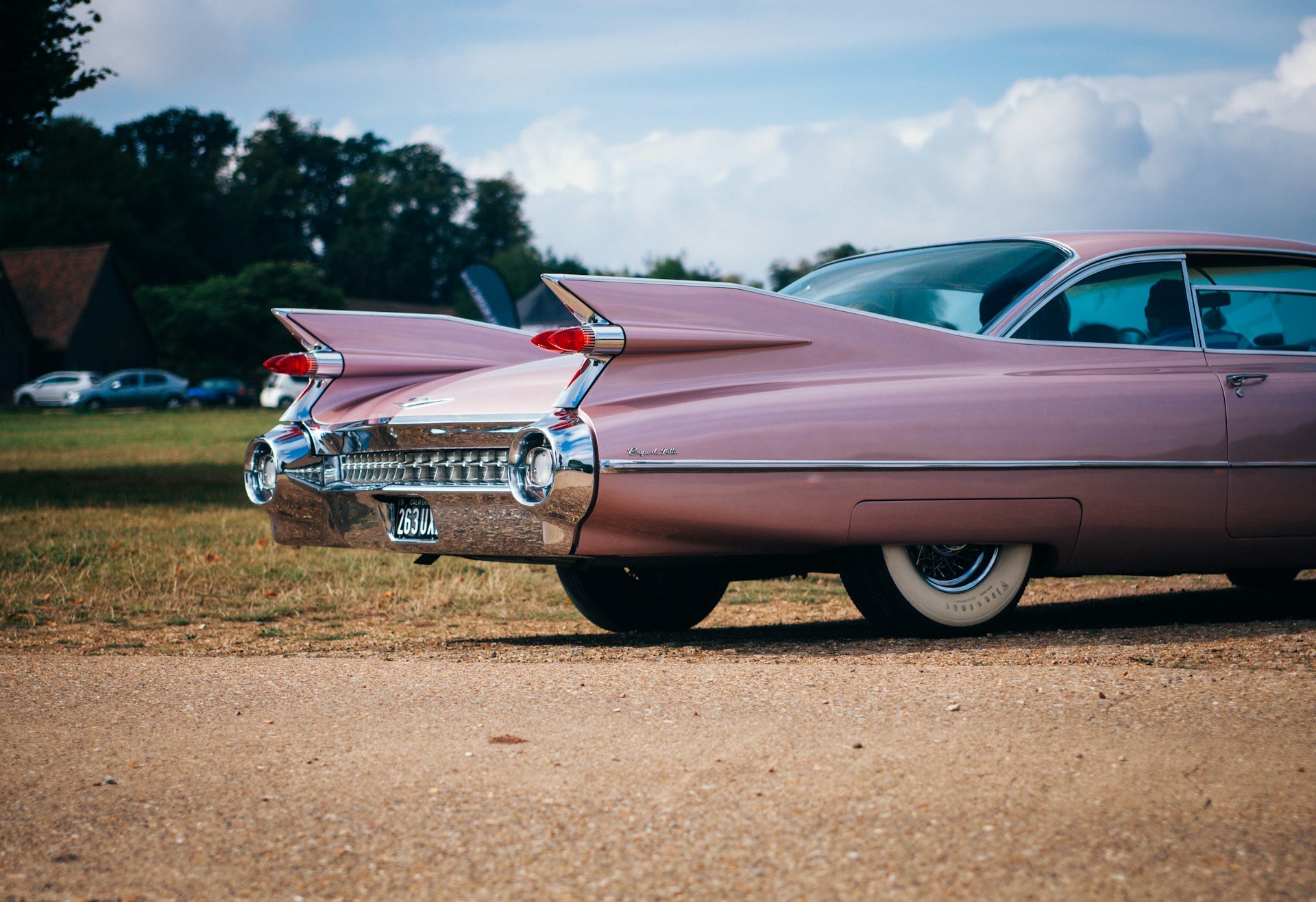 A image of a classic pink cadillac.