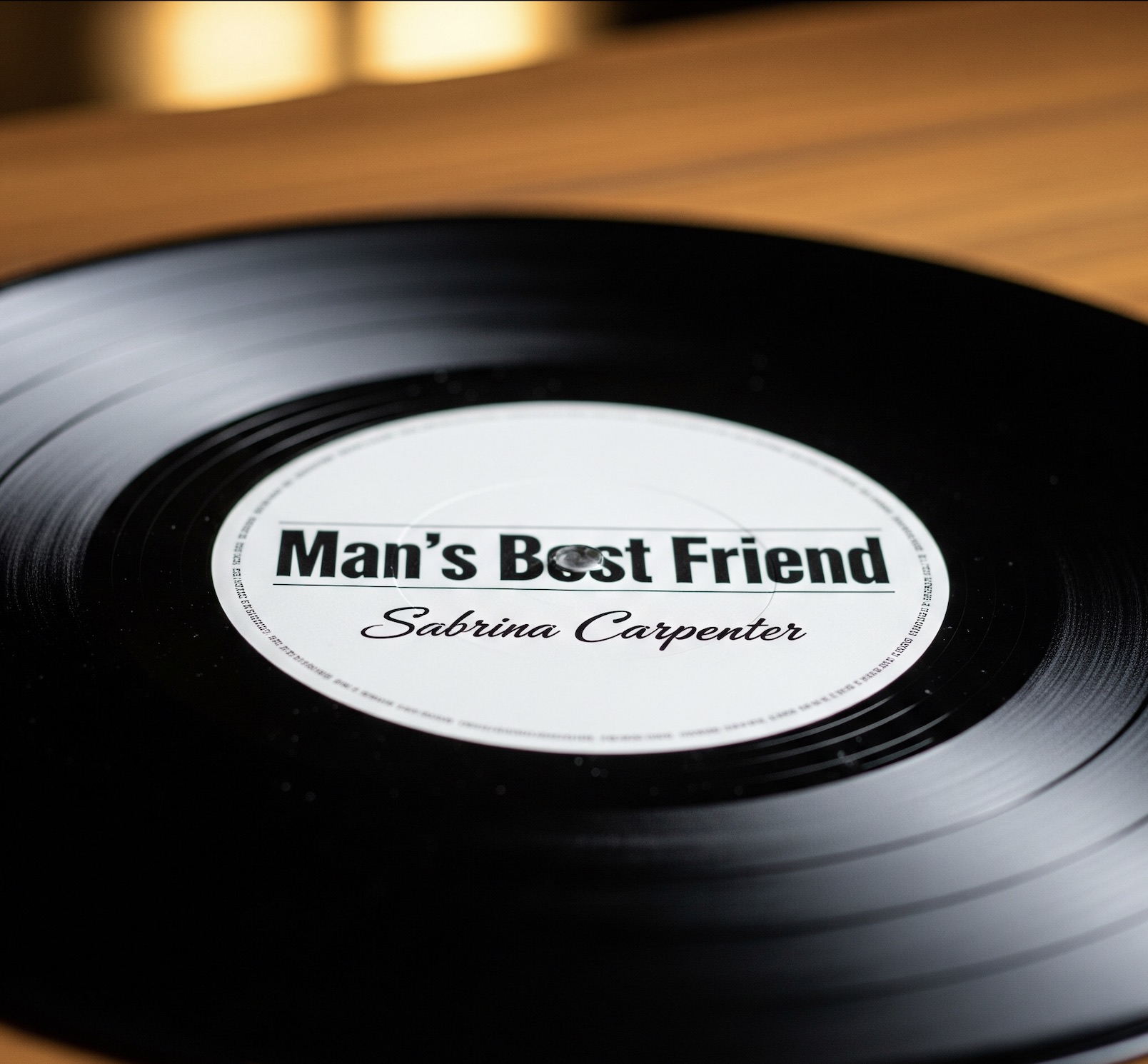 An image of a vinyl record labeled Man's Best Friend by Sabrina Carpenter.