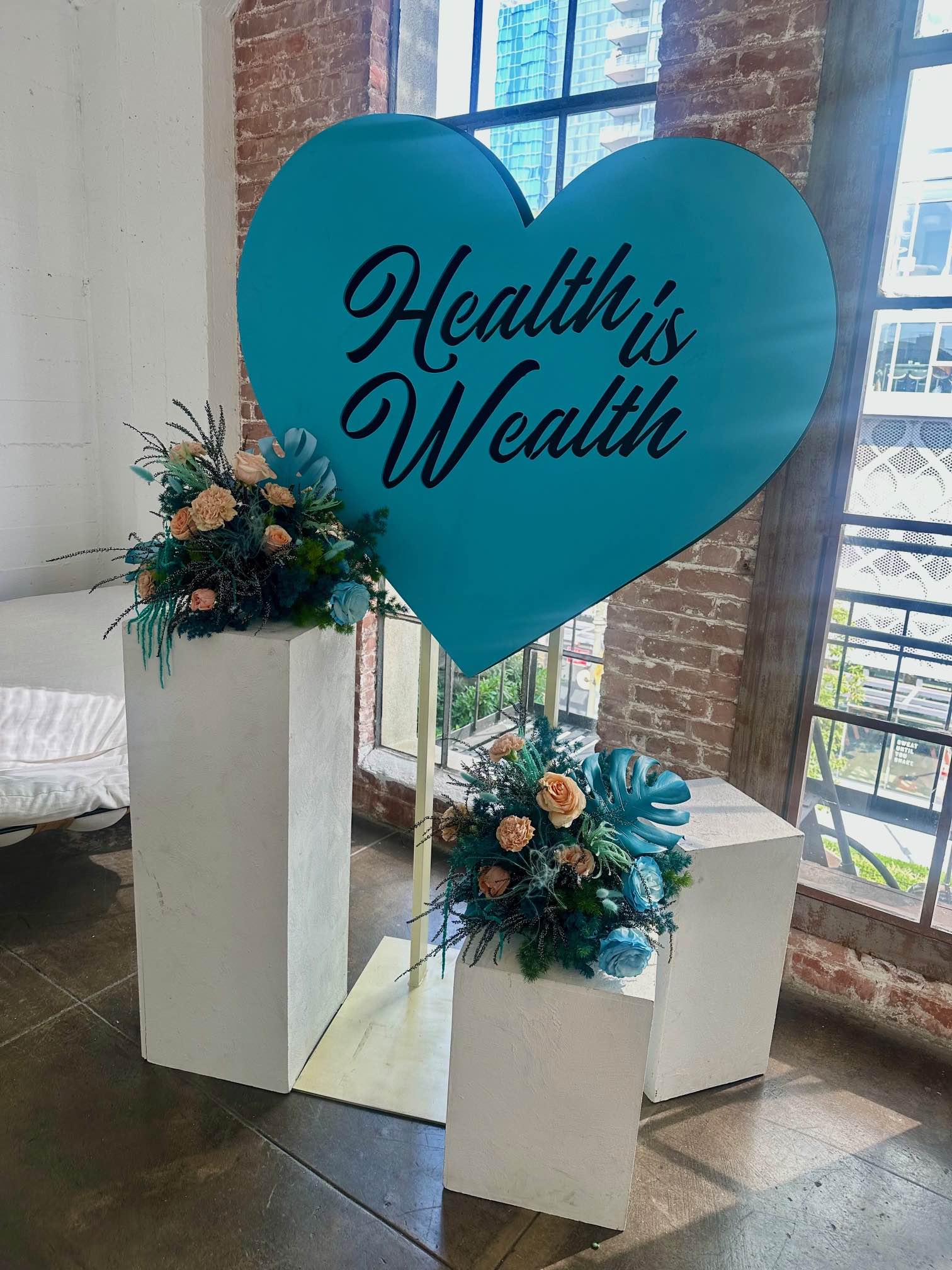 An image of a sign that says Health is Wealth.