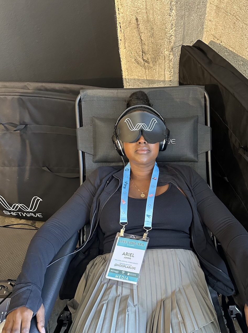 An image of lifestyle blogger Ariel sitting in a Shiftwave relaxation chair.