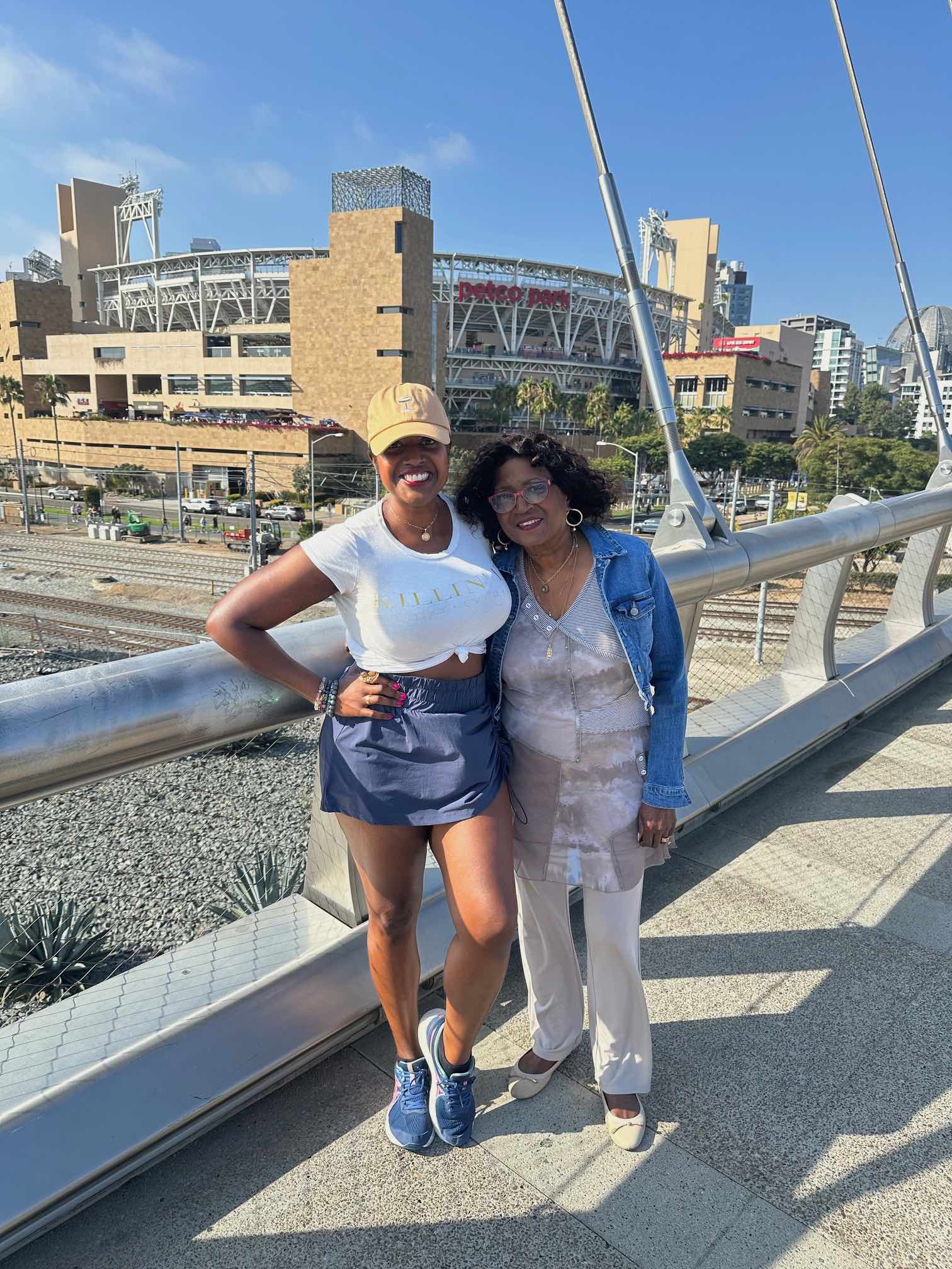 An image of lifestyle blogger Ariel and her mom on the Harbor Drive Pedestrian Bridge across from Petco Park.