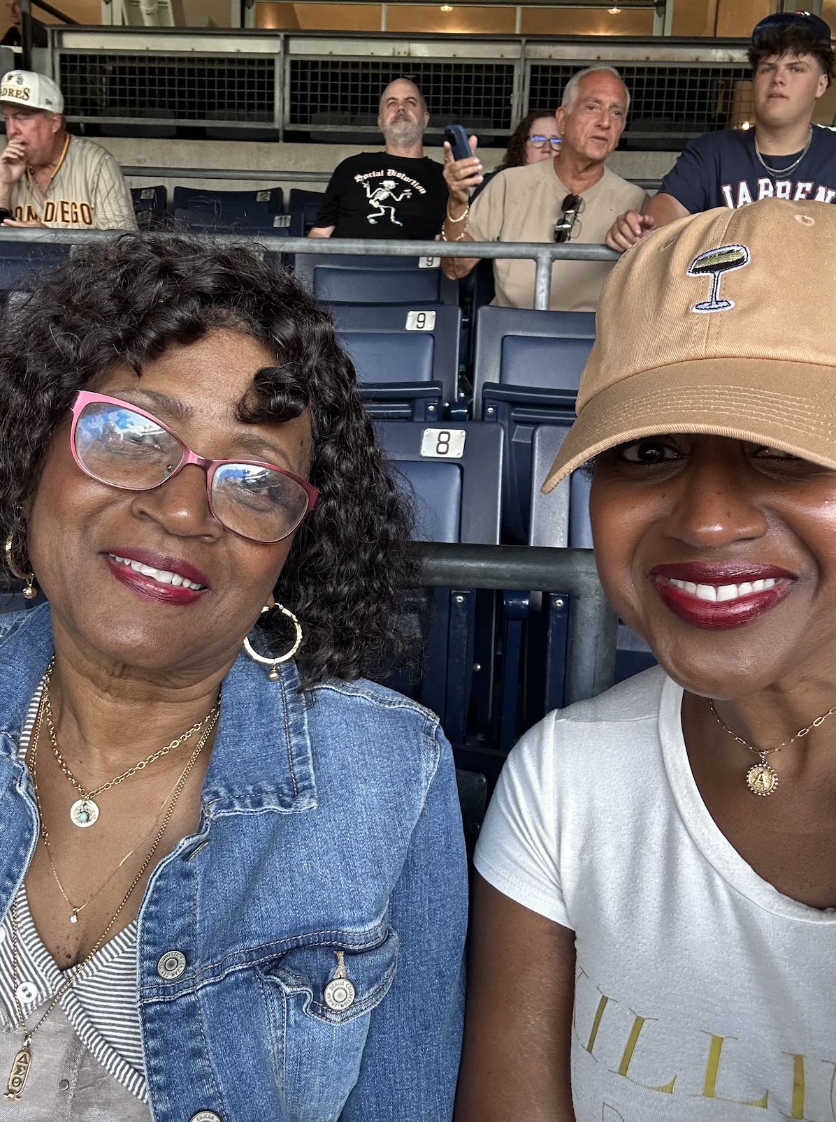 An image of lifestyle blogger Ariel with her mom sitting at Petco Park.