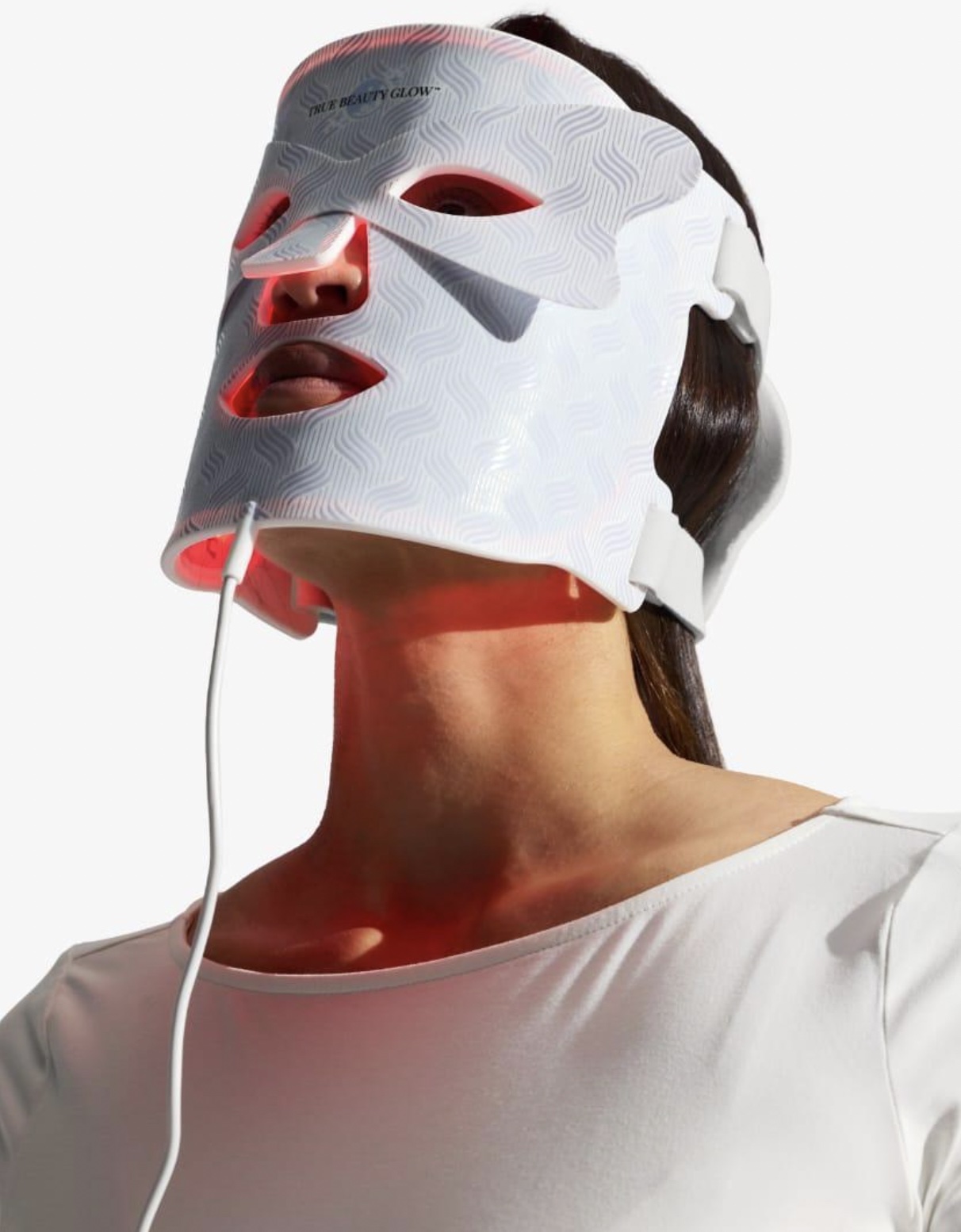 An image of a woman wearing the Luxe LED Mask.