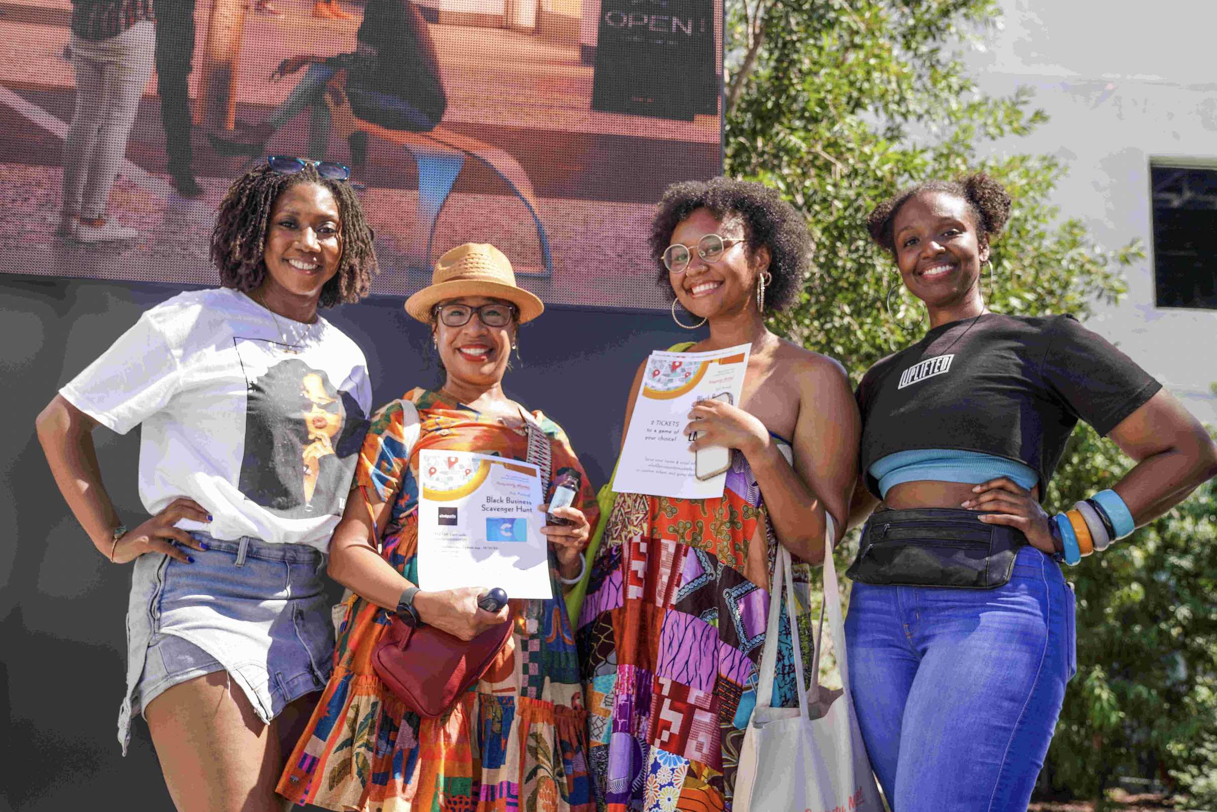 An image of people promoting the Black Business Scavenger Hunt.]