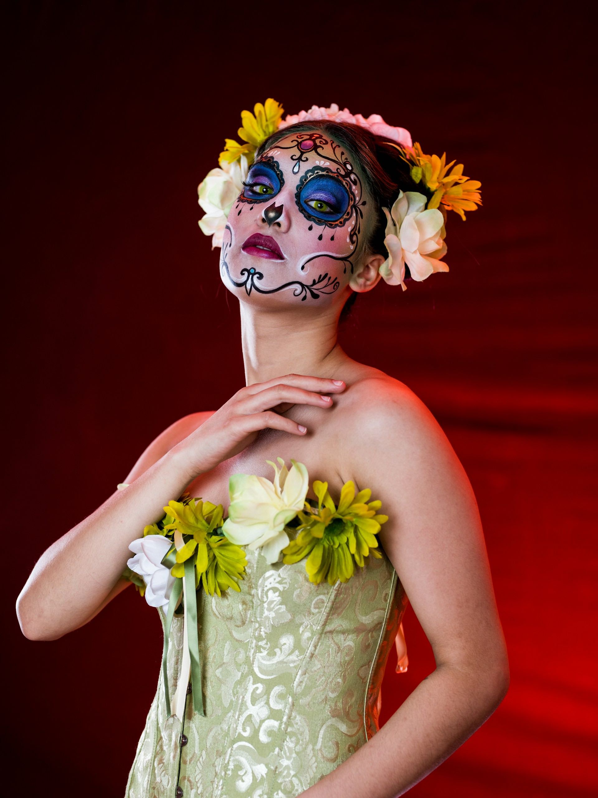 An image of a woman dressed up for Día de los Muertos.
