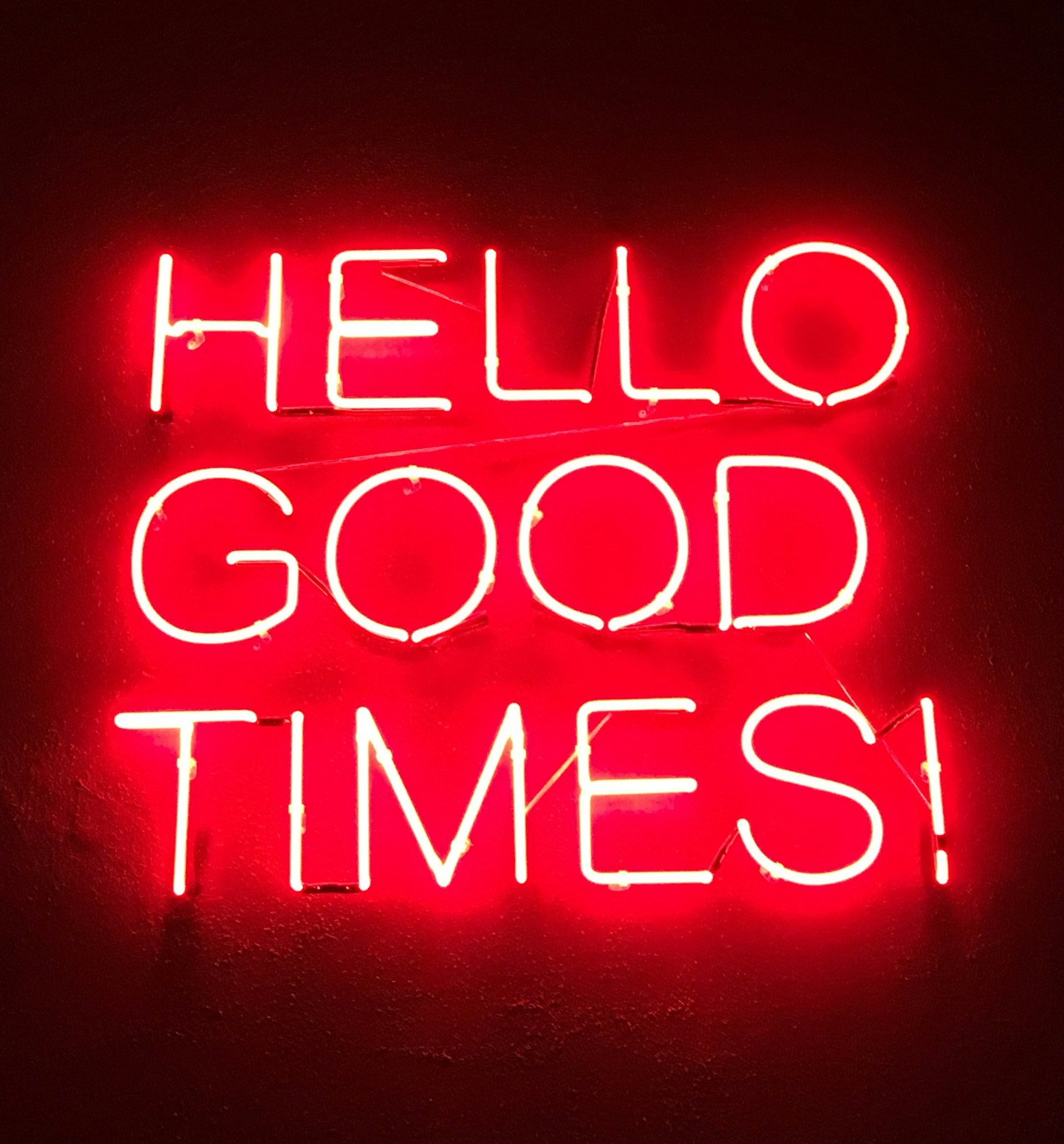 An image of a sign that reads "Hello Good Times!"