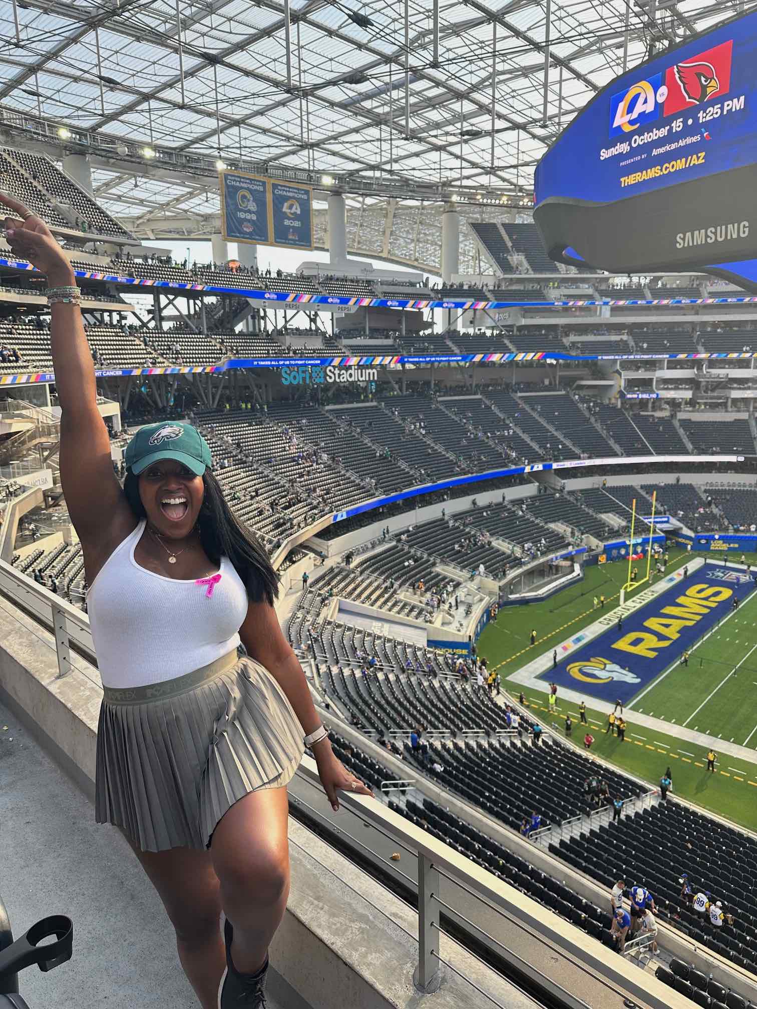 An image of lifestyle blogger Ariel Johns in Eagles gear at SoFi.