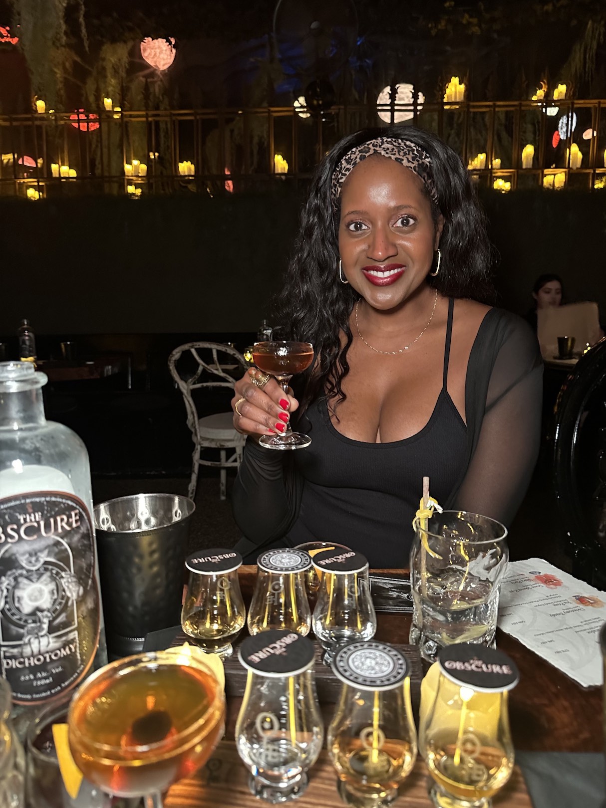 An image of lifestyle blogger Ariel at the Obscure cocktail experience.
