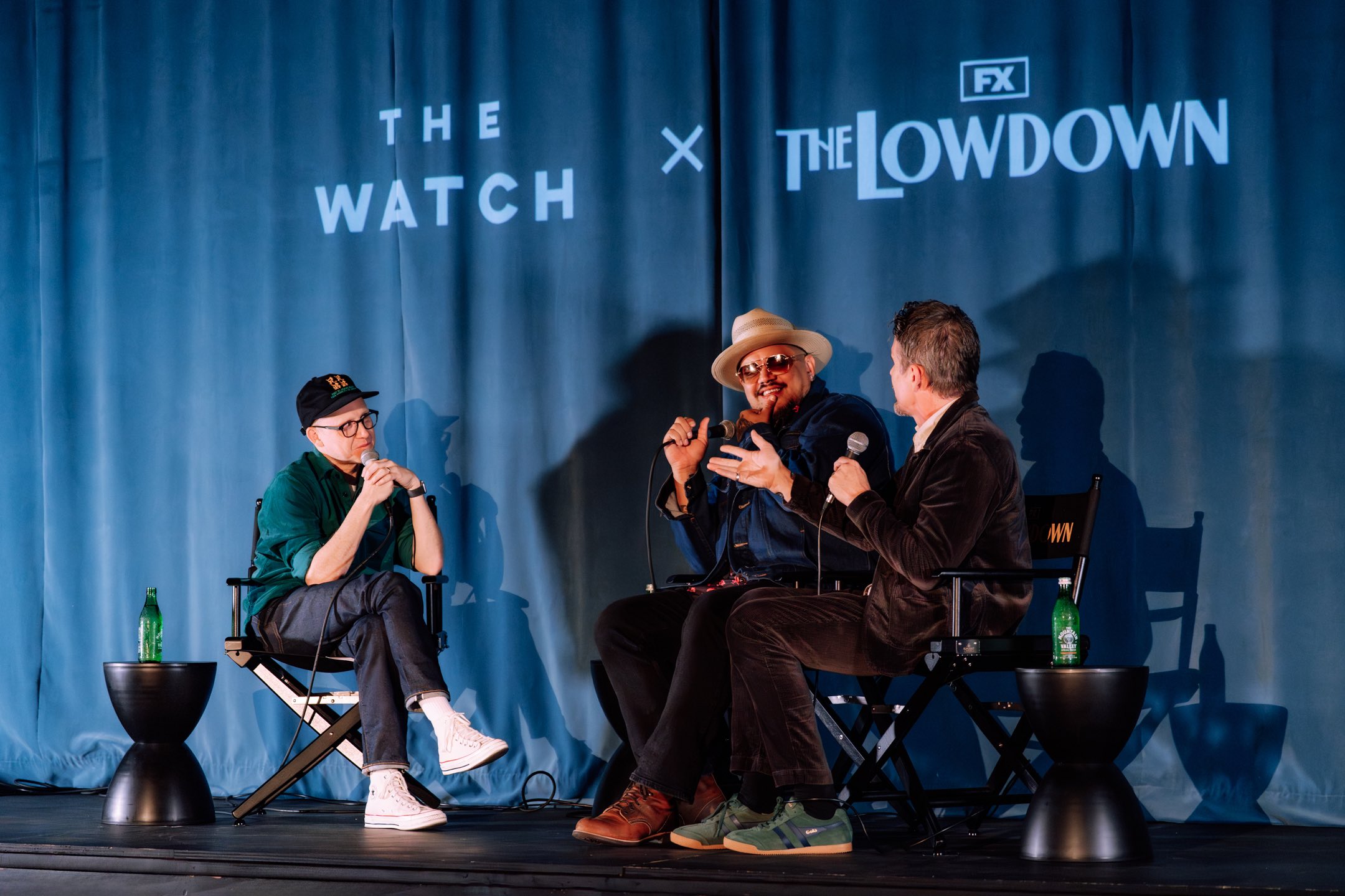 An image of Chris Ryan moderating a live recording of The Ringer’s The Watch podcast with The Lowdown's creator Sterlin Harjo and series star and Executive Producer Hawke.