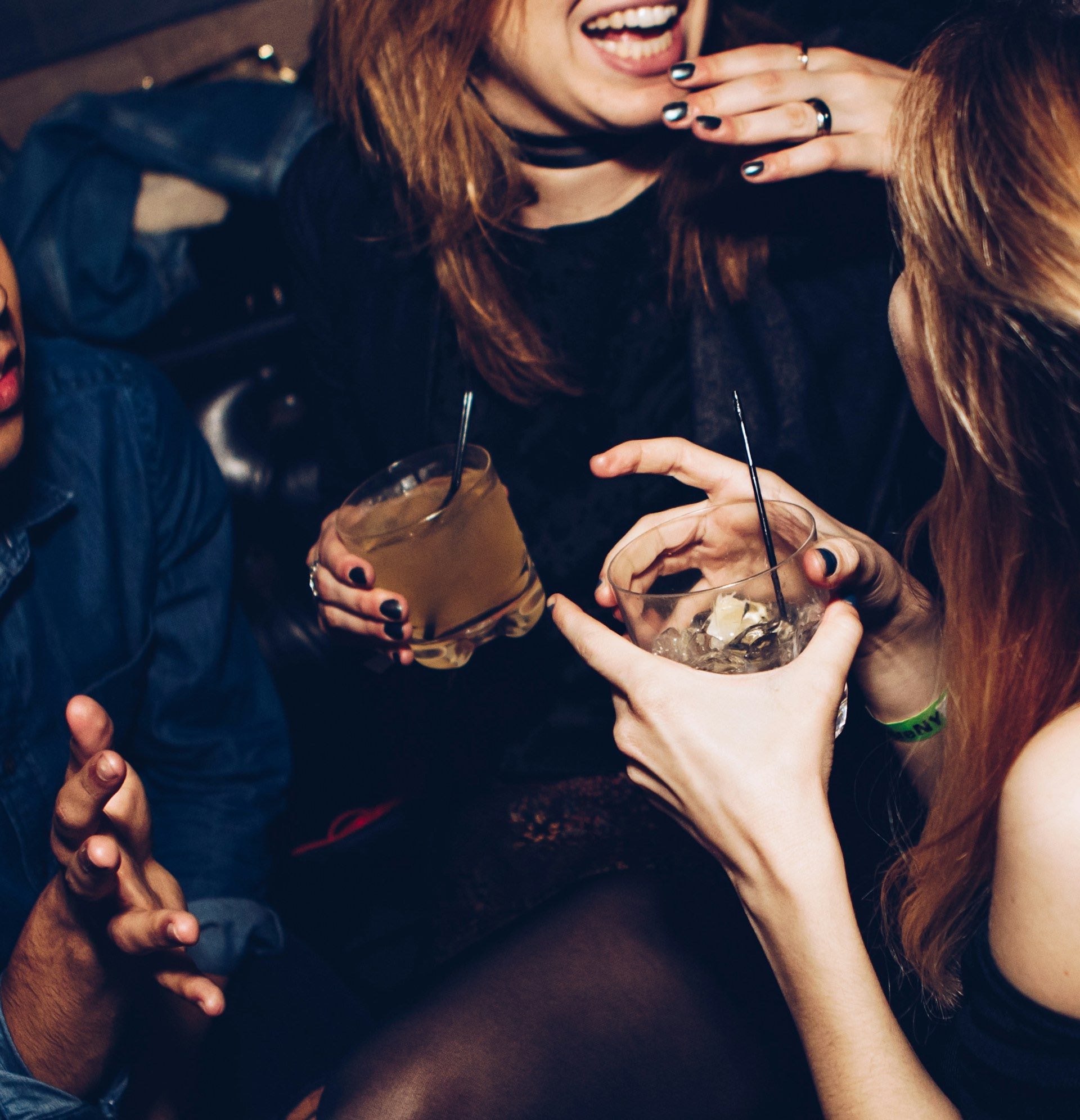 An image of people socializing with cocktails.