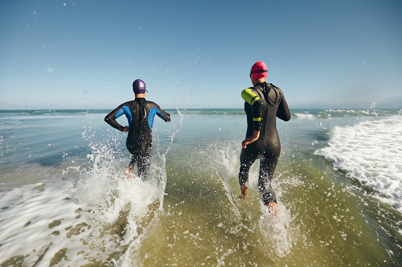 An image of two people swimming in a triathlon.