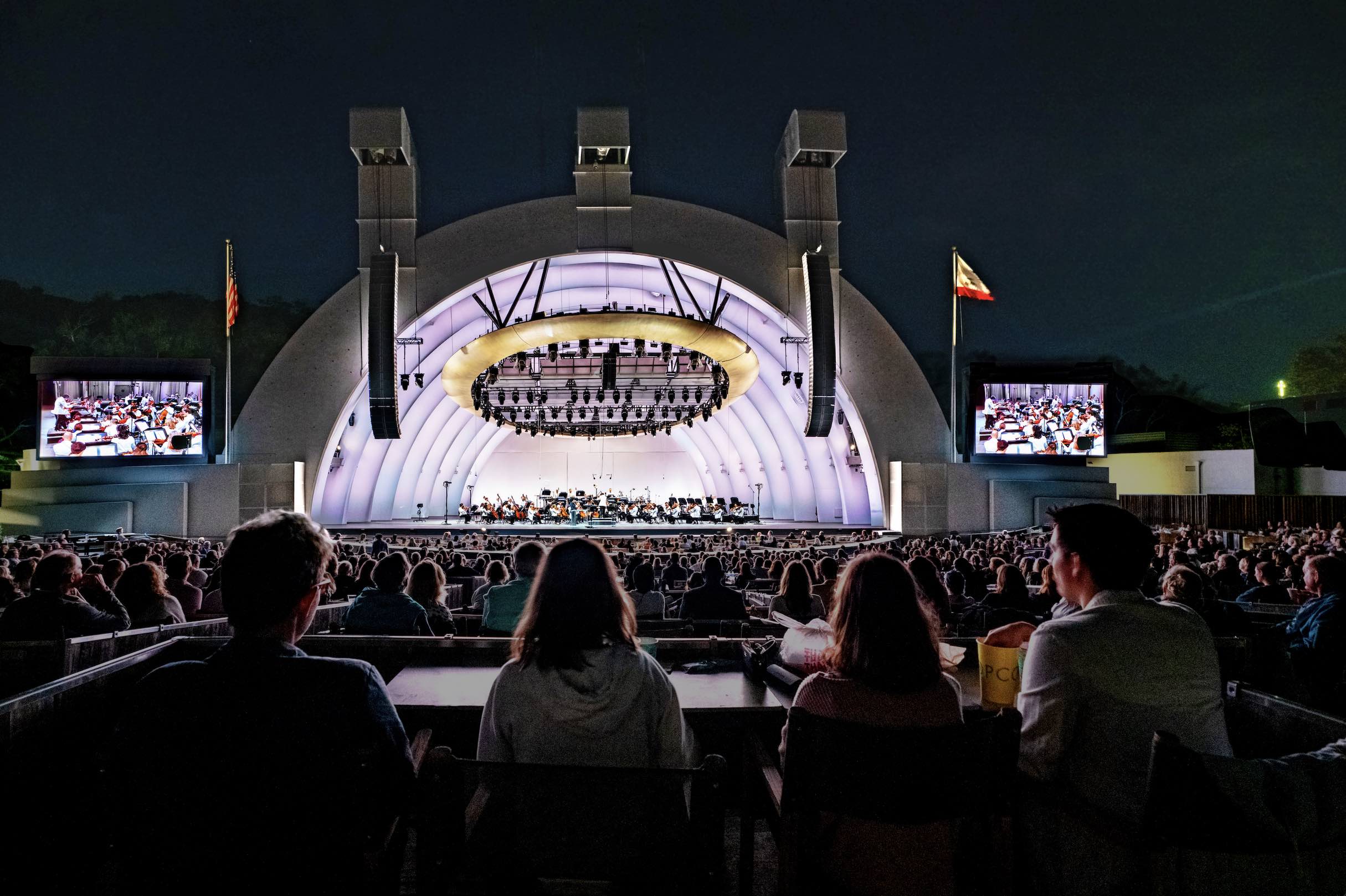 An image of people sitting at the Hollywood Bowl.