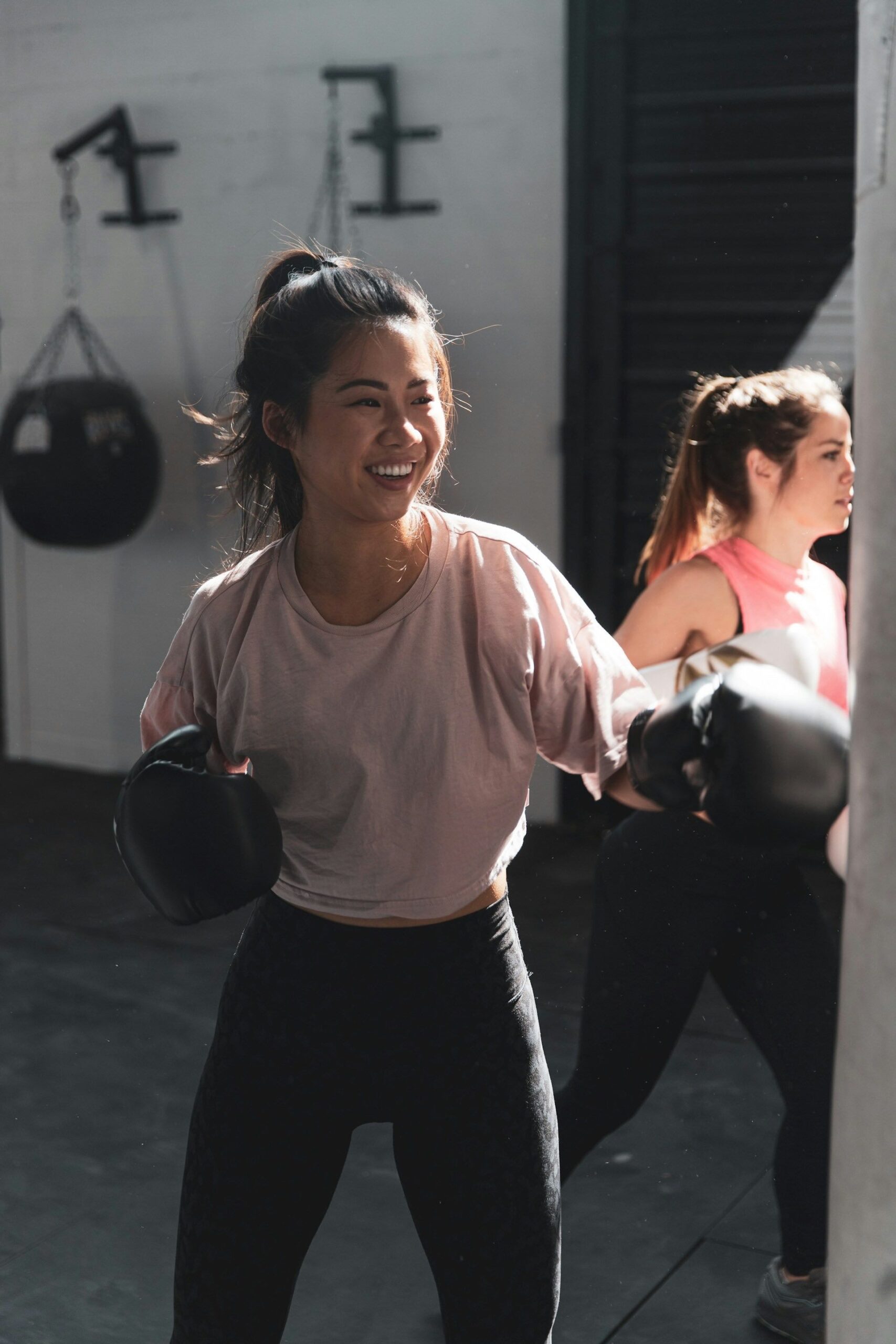 An image of a young Asian woman boxing.