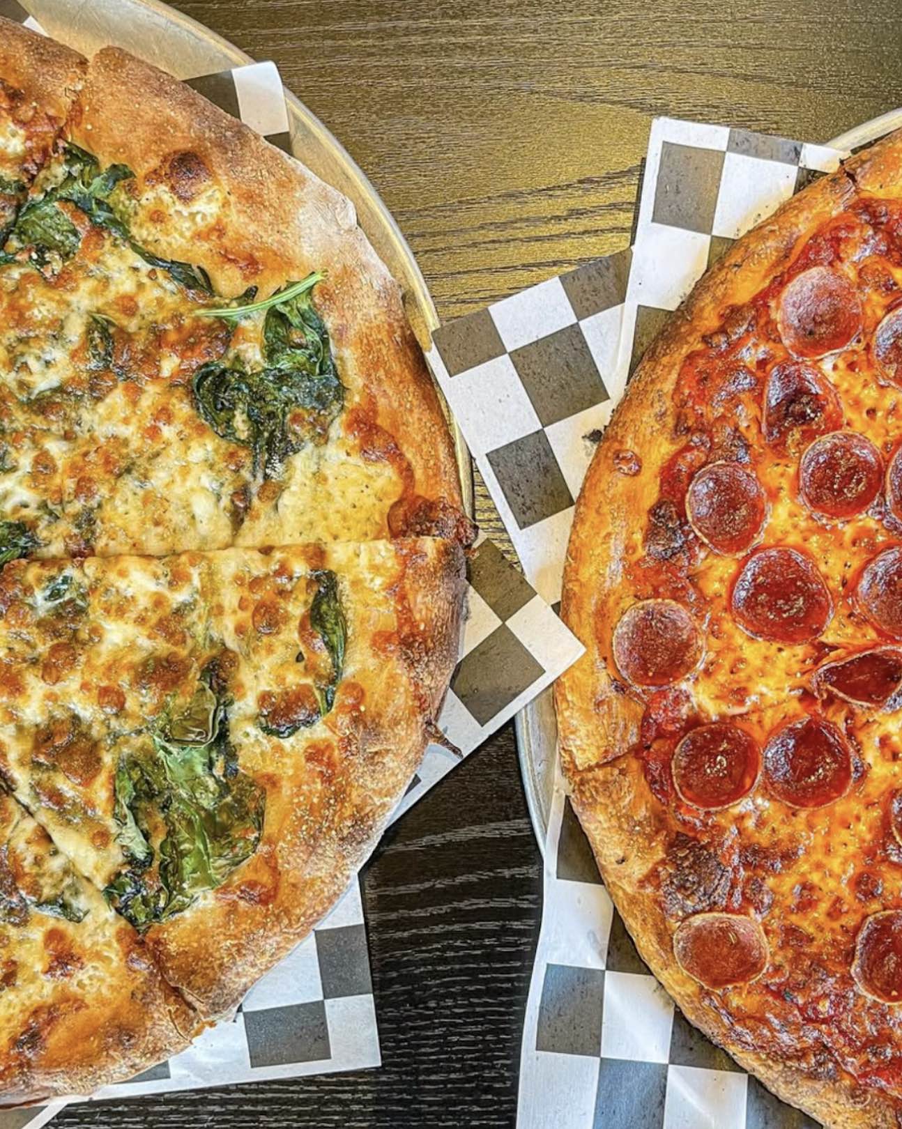 An image of two of Ozzys APizza's pizzas.