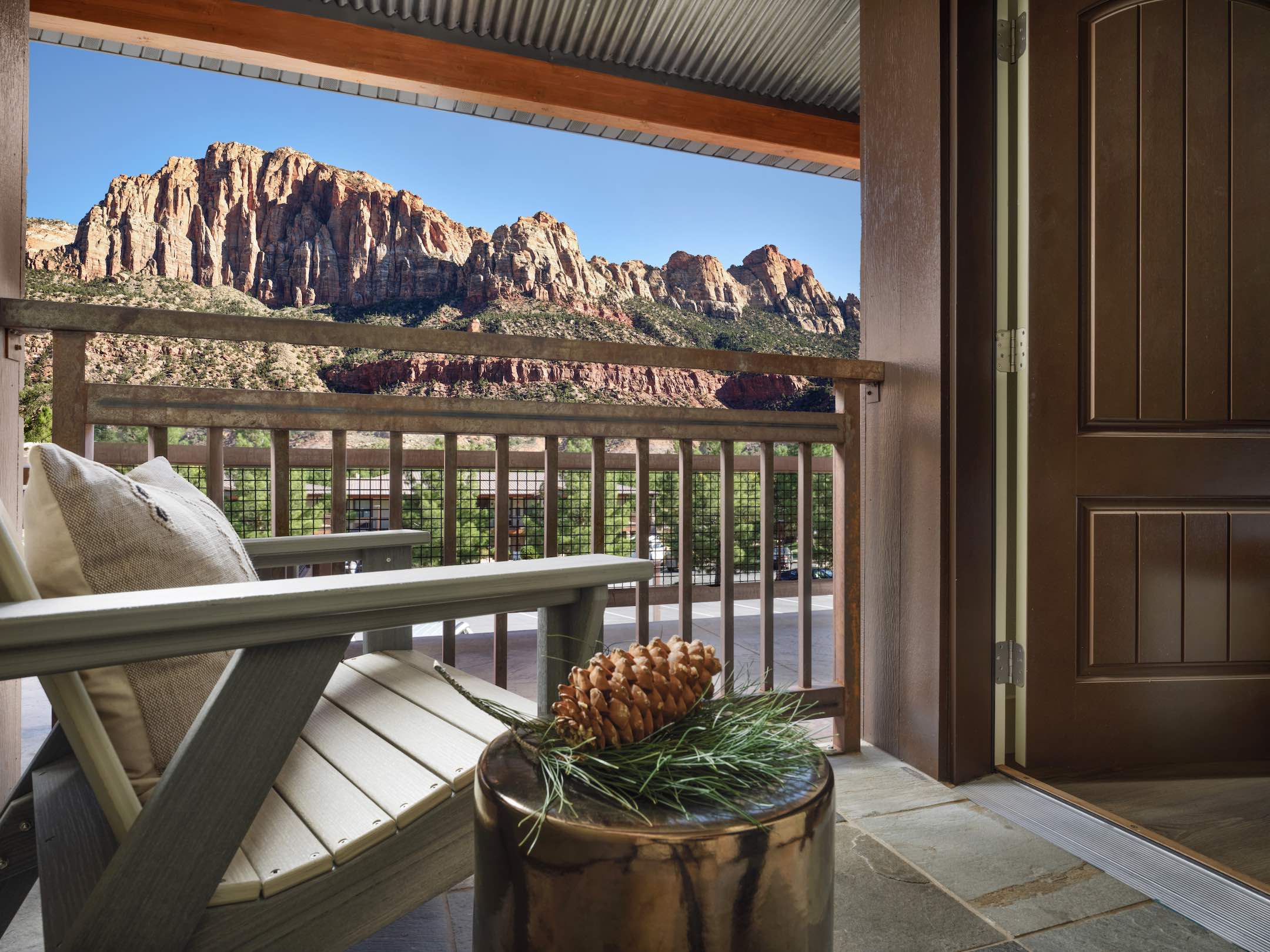 An image of the balcony and red cliffs of Red Cliffs Lodge Zion, a Tribute Portfolio Hotel.