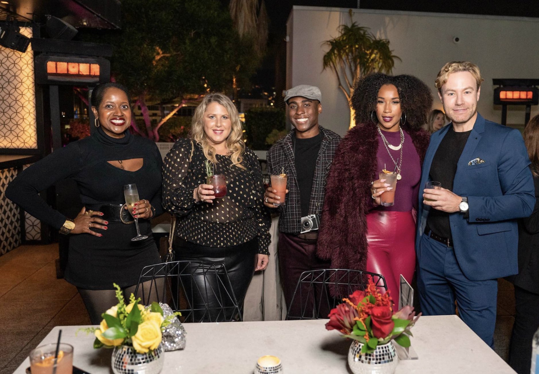 An image of lifestyle blogger Ariel Johns with cocktail guru Paul Zahn and others.