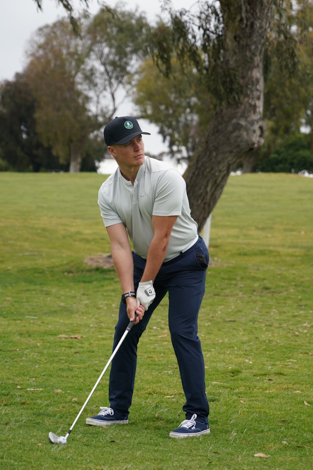An image of a man golfing.