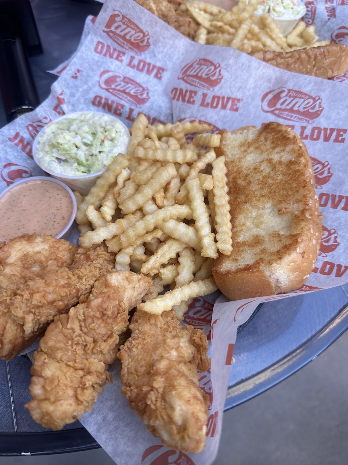 An image of Raising Cane's ONE LOVE® – Craveable Chicken Finger Meals®.
